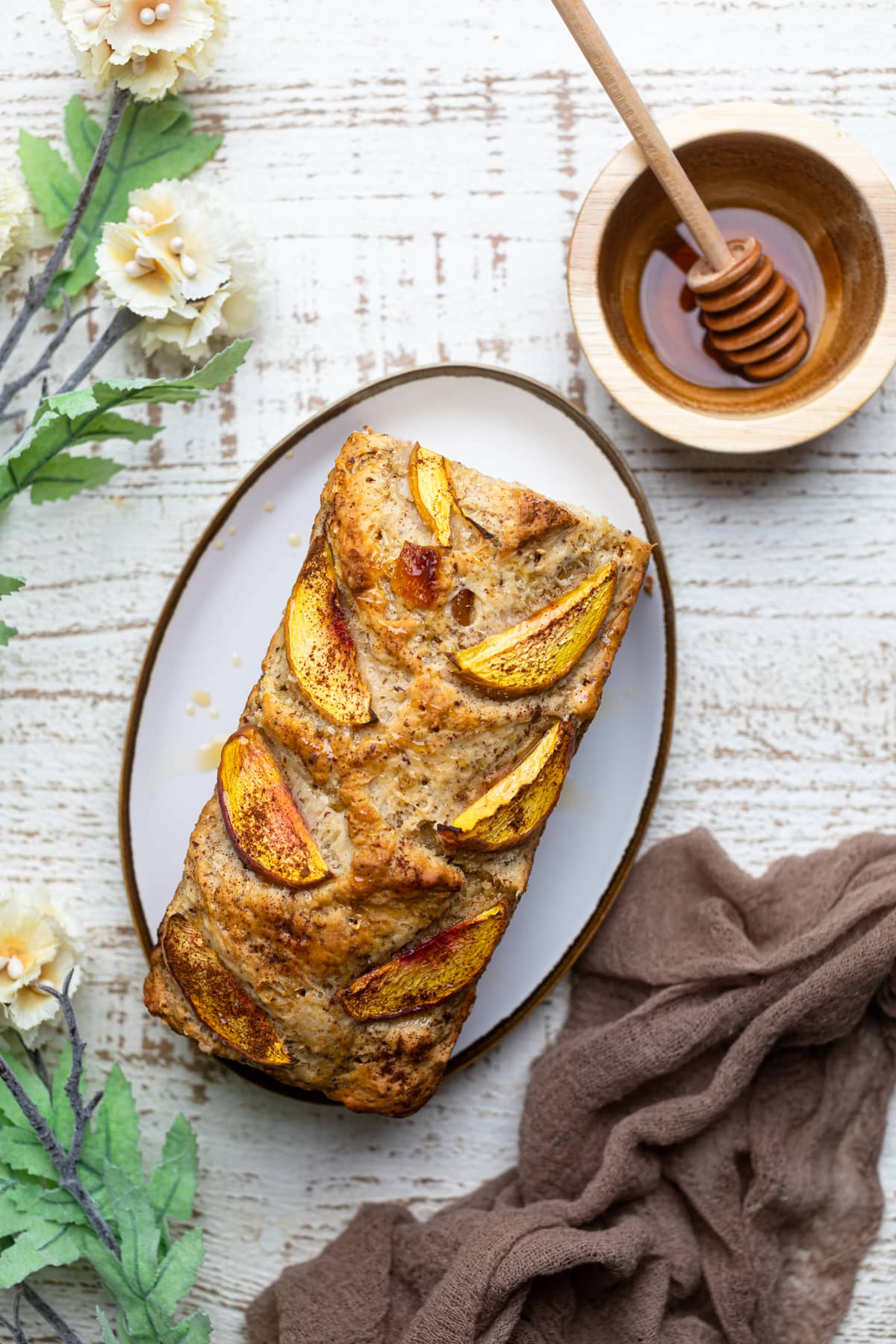 Loaf of Cinnamon Maple Peach Bread on a platter