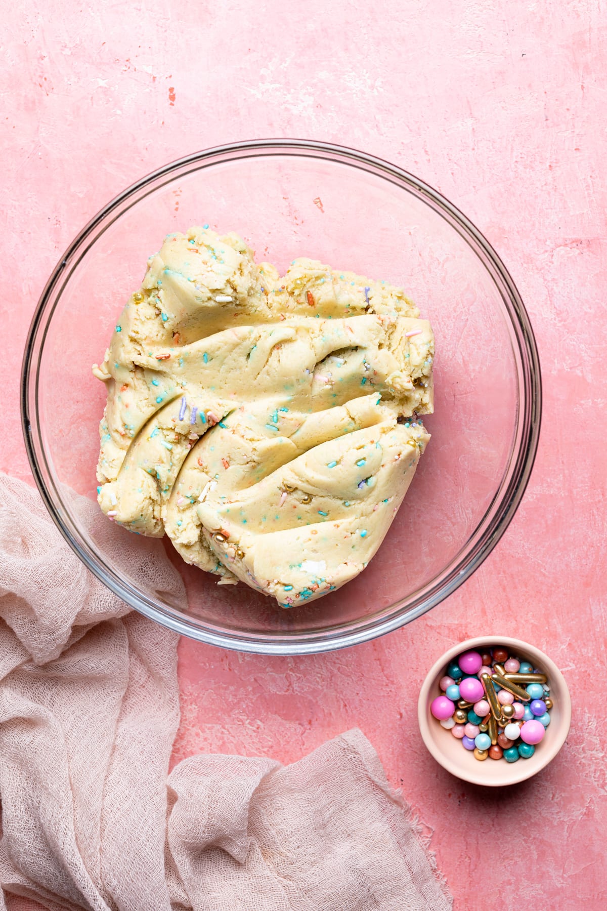 Funfetti Cookies dough in a glass bowl