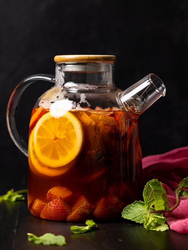 Glass pitcher of Roasted Dandelion Strawberry Tea
