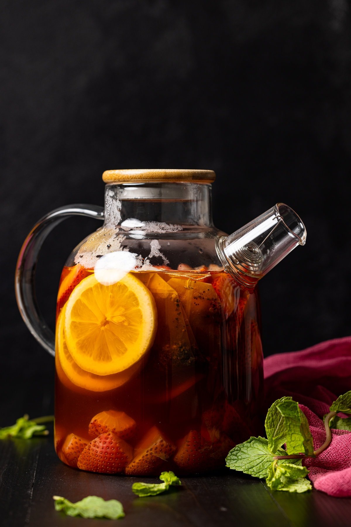 Glass pitcher of Roasted Dandelion Strawberry Tea