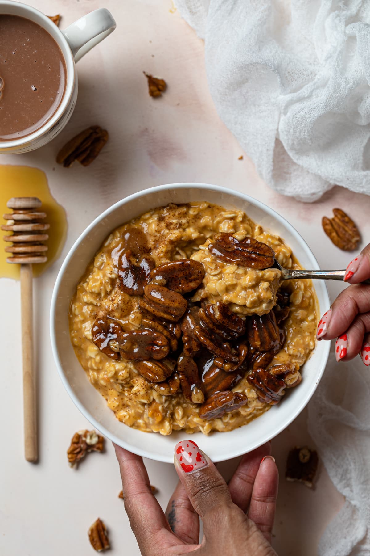 Spoon scooping Sweet Potato Pie Overnight Oats from a bowl.