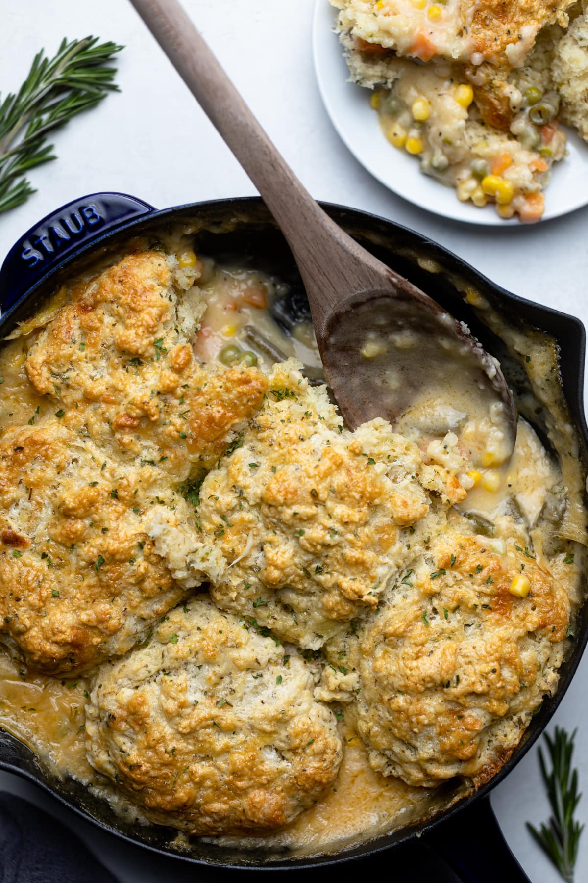 Wooden spoon in a skillet of Vegan Pot Pie