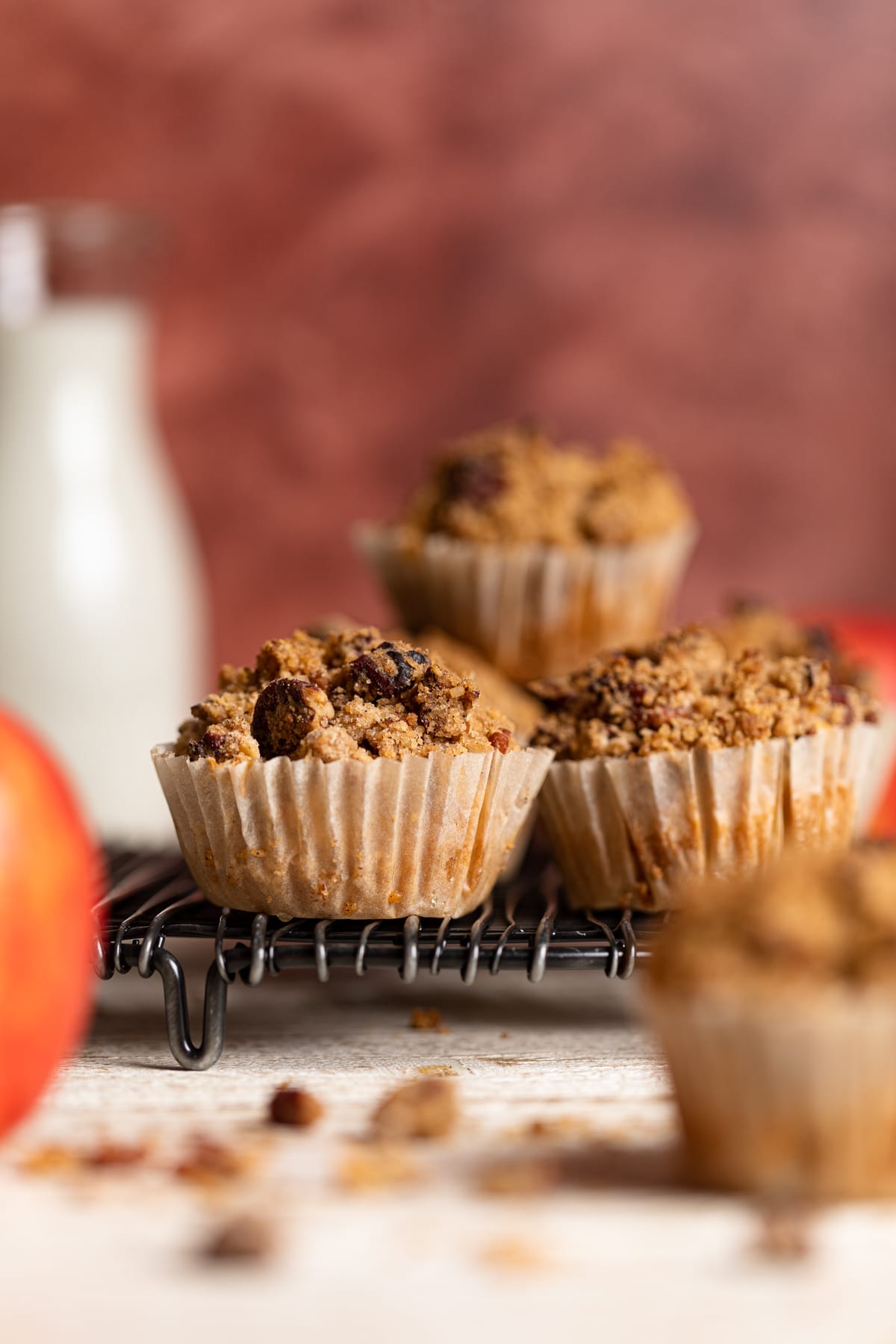 Stack of Vegan Apple Spice Muffins on a wire rack