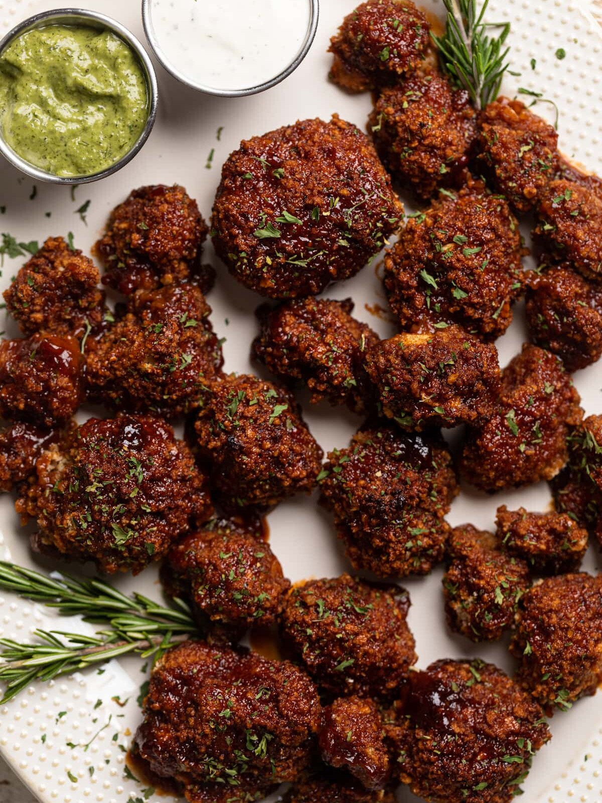 BBQ Cauliflower Wings on a serving platter with two dips