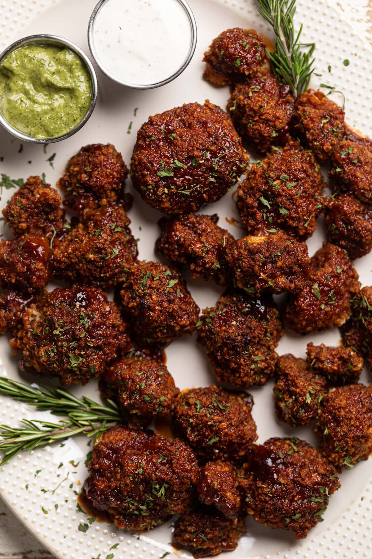 BBQ Cauliflower Wings on a serving platter with two dips