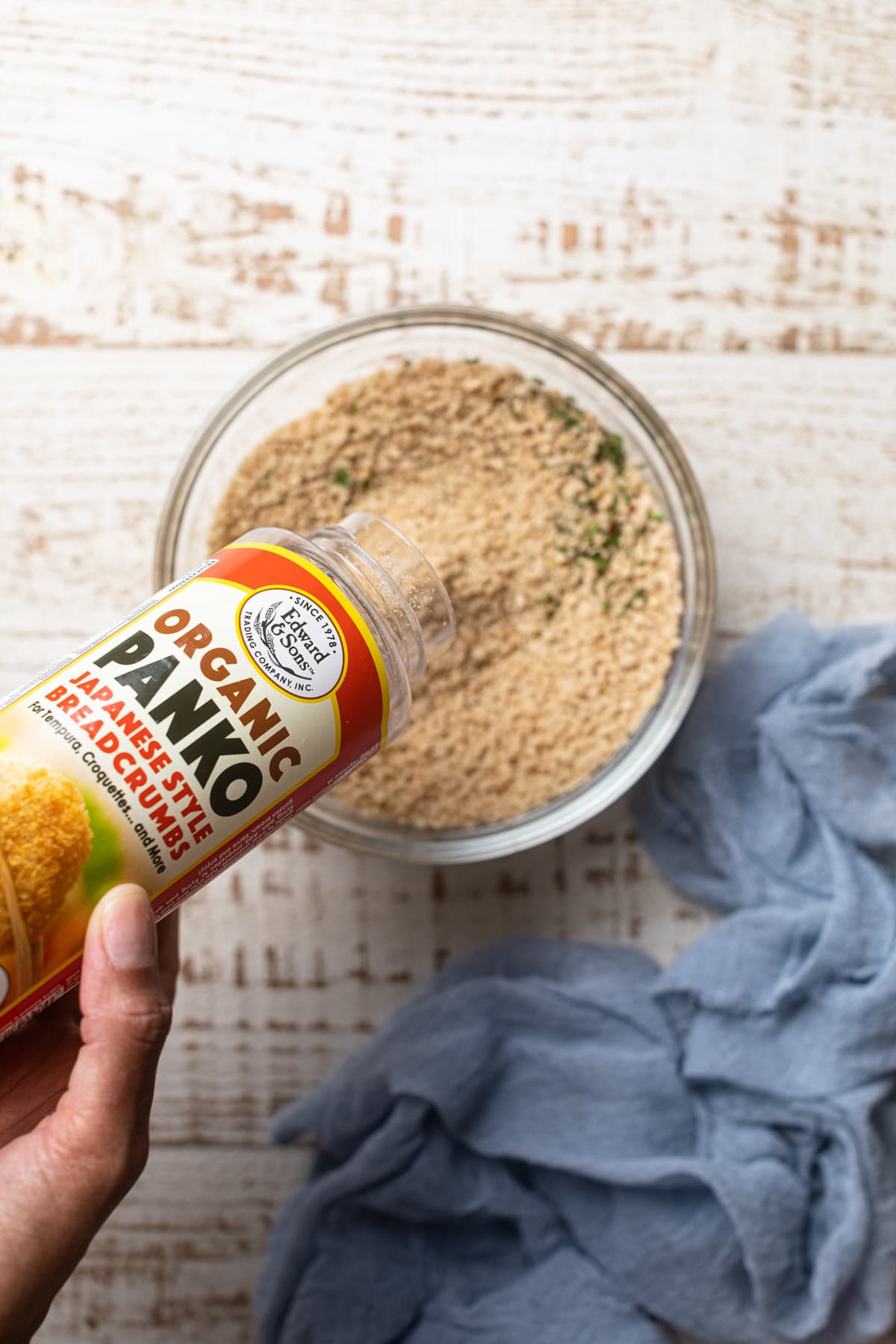 Jar of organic panko bread crumbs pouring into a bowl