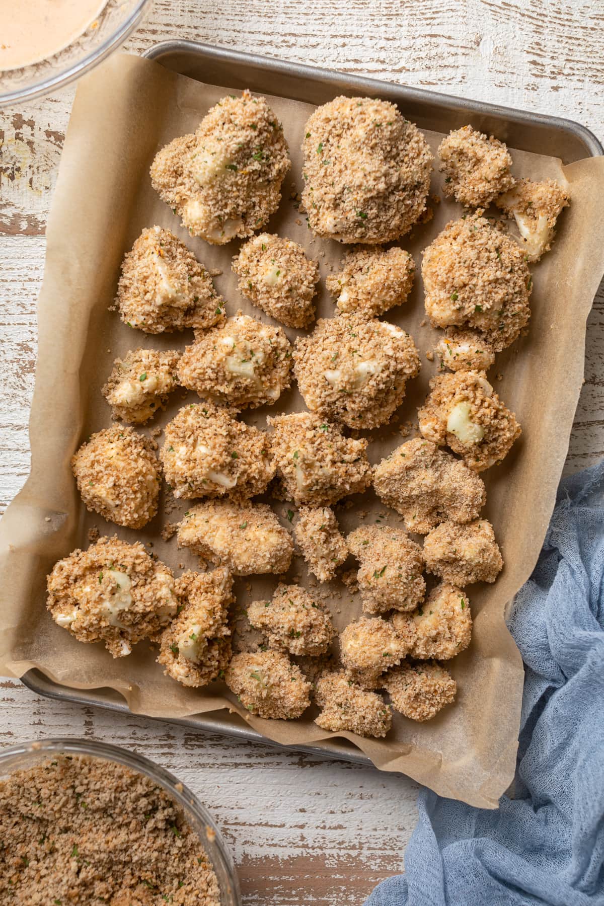 Breaded cauliflower on a baking sheet