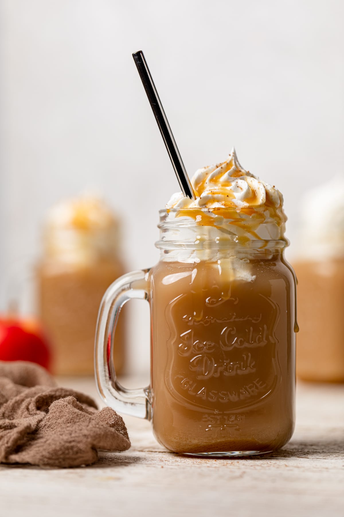 Dairy-free Caramel Apple Cider Drink in a glass jar with a handle