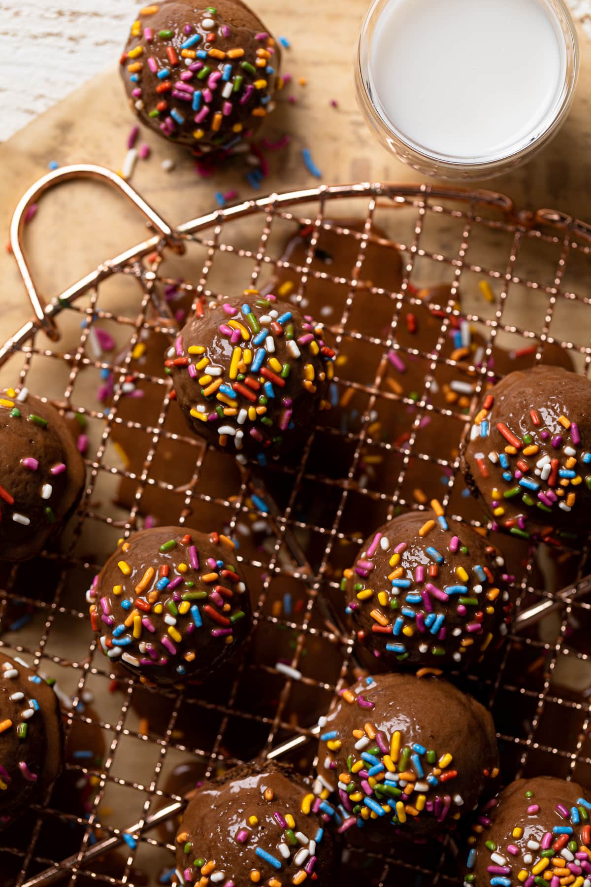 Closeup of Vegan Chocolate Donut Holes on a wire rack