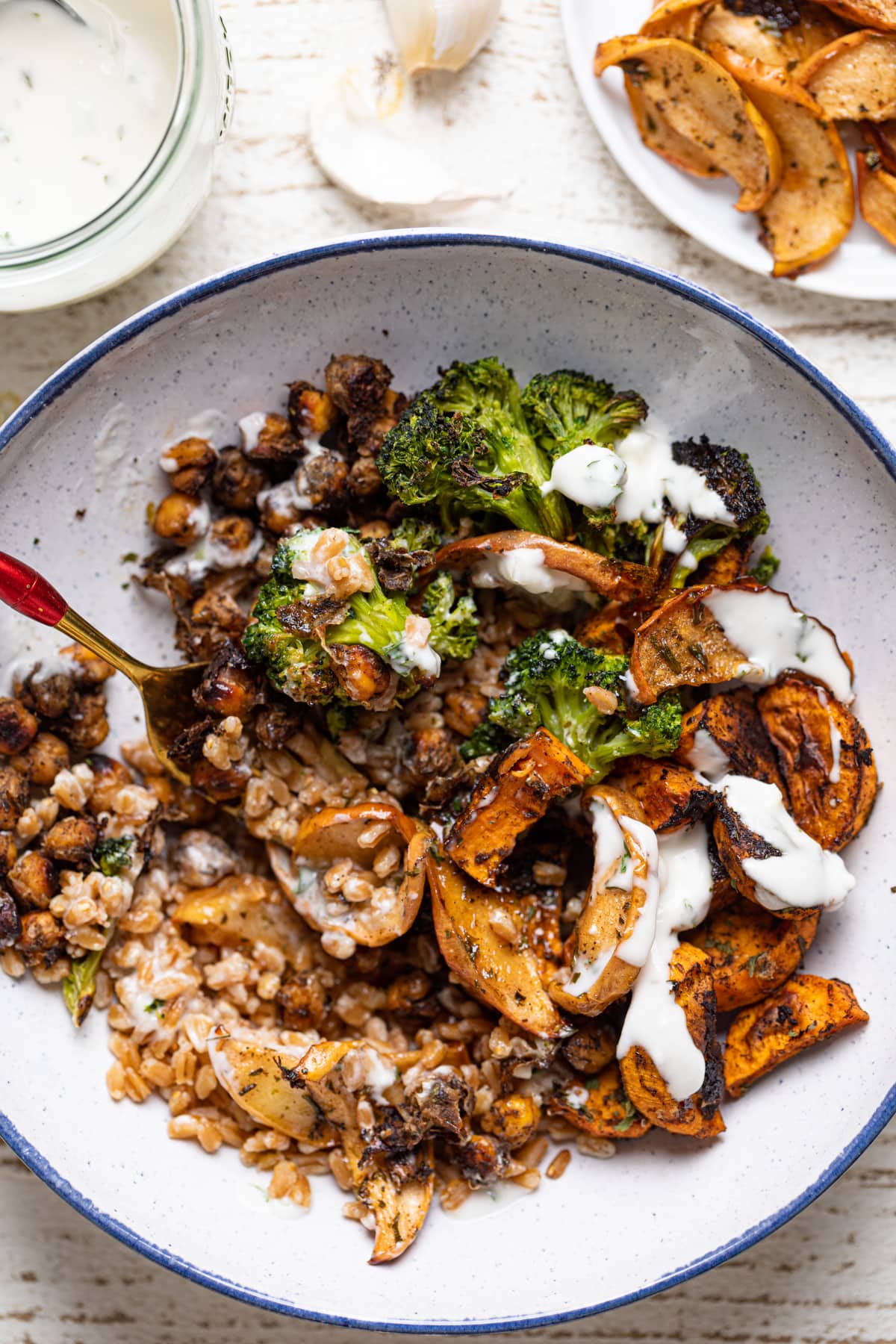 Fork digging into a Jerk Vegetable Farro Bowl 