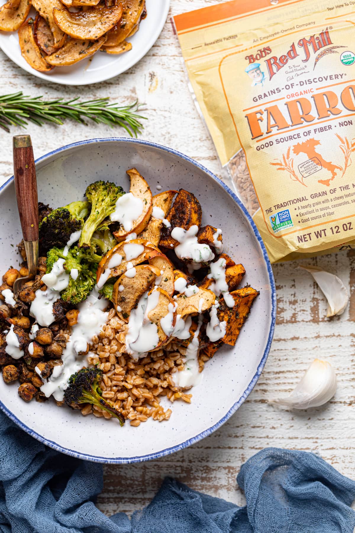 Jerk Vegetable Farro Bowl next to a bag of Bob\'s Red Mill Farro