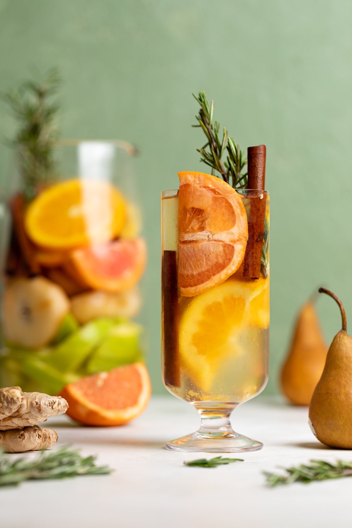 Tall glass of Citrus Ginger Pear Detox Infused Water.