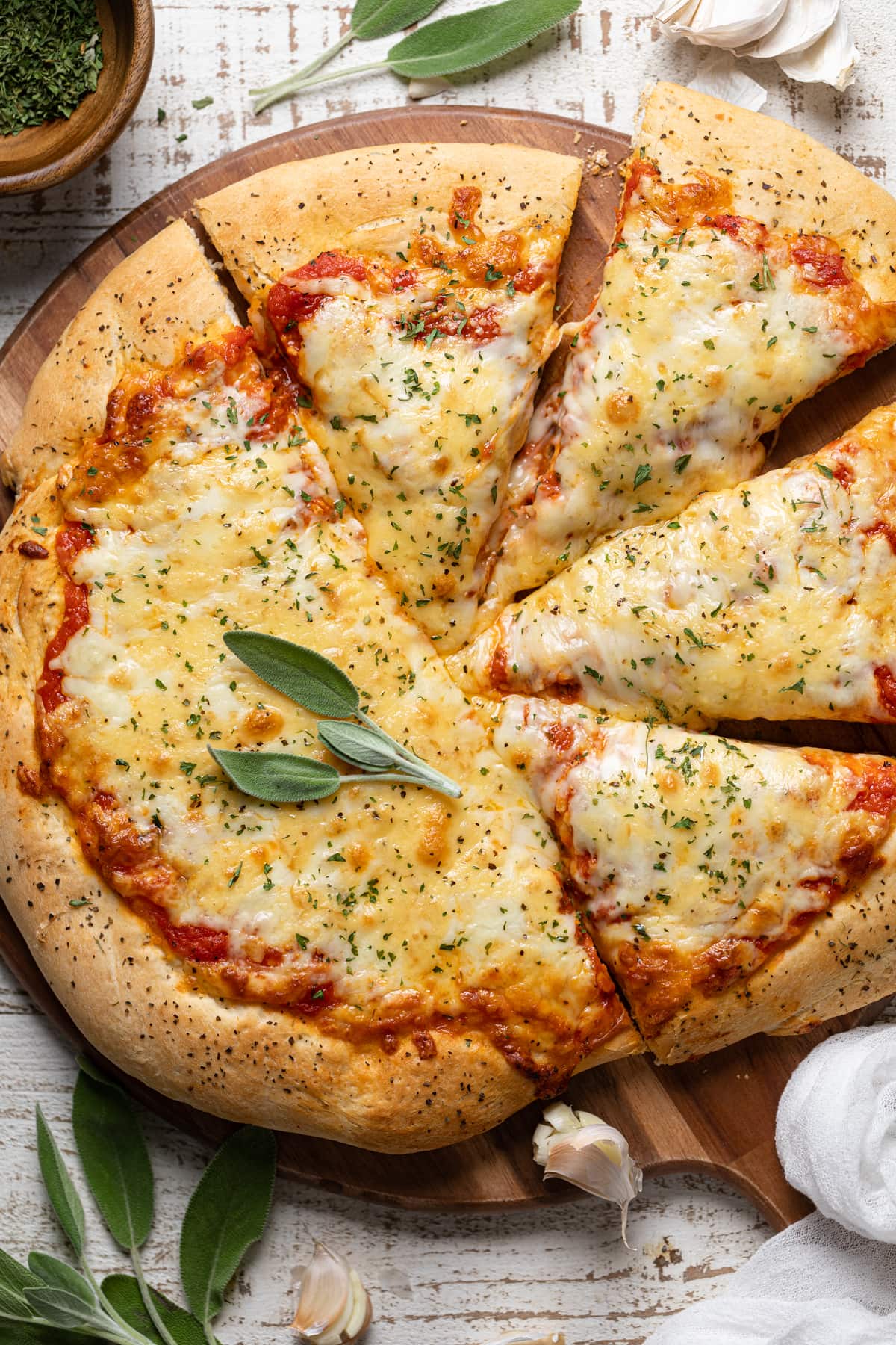 Partially-sliced Homemade Garlic Herb Cheese Pizza