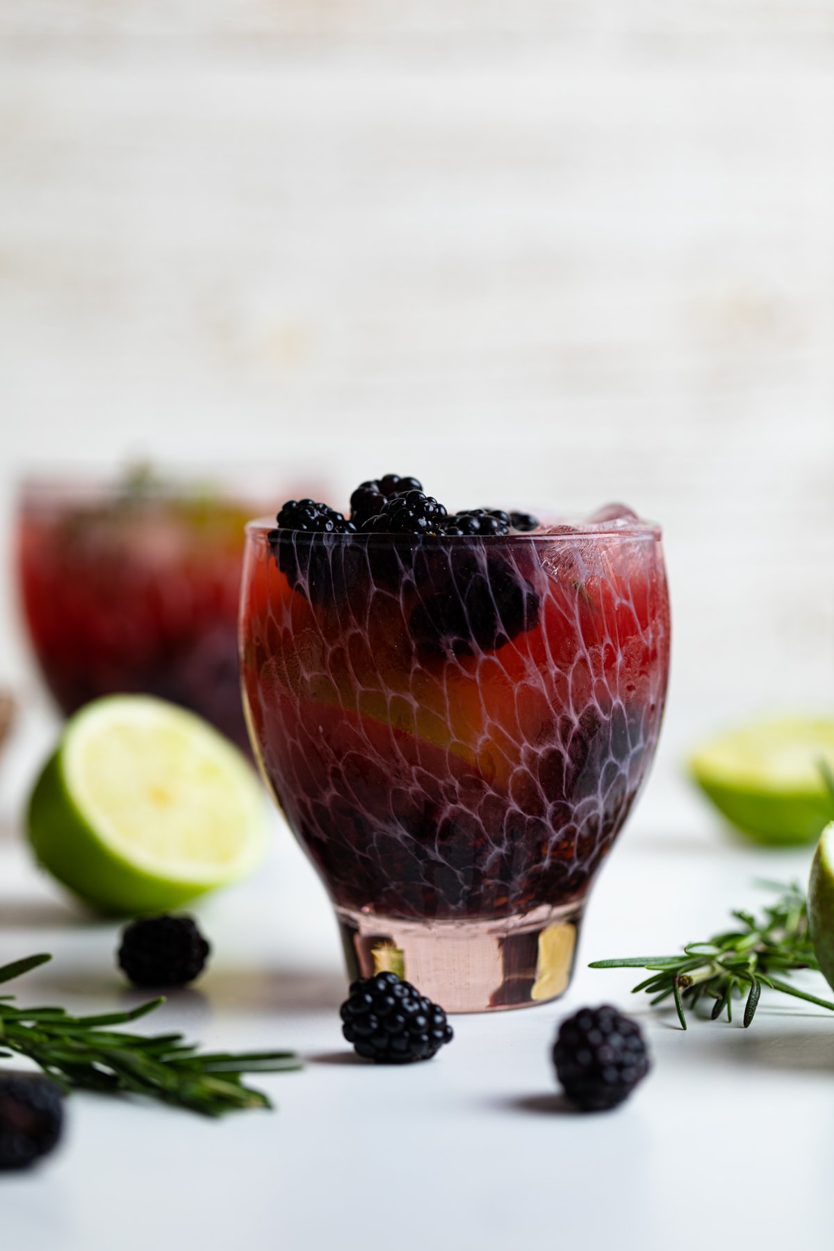 Blackberry Lime Mocktail stuffed with blackberries, lime wedges, and ice