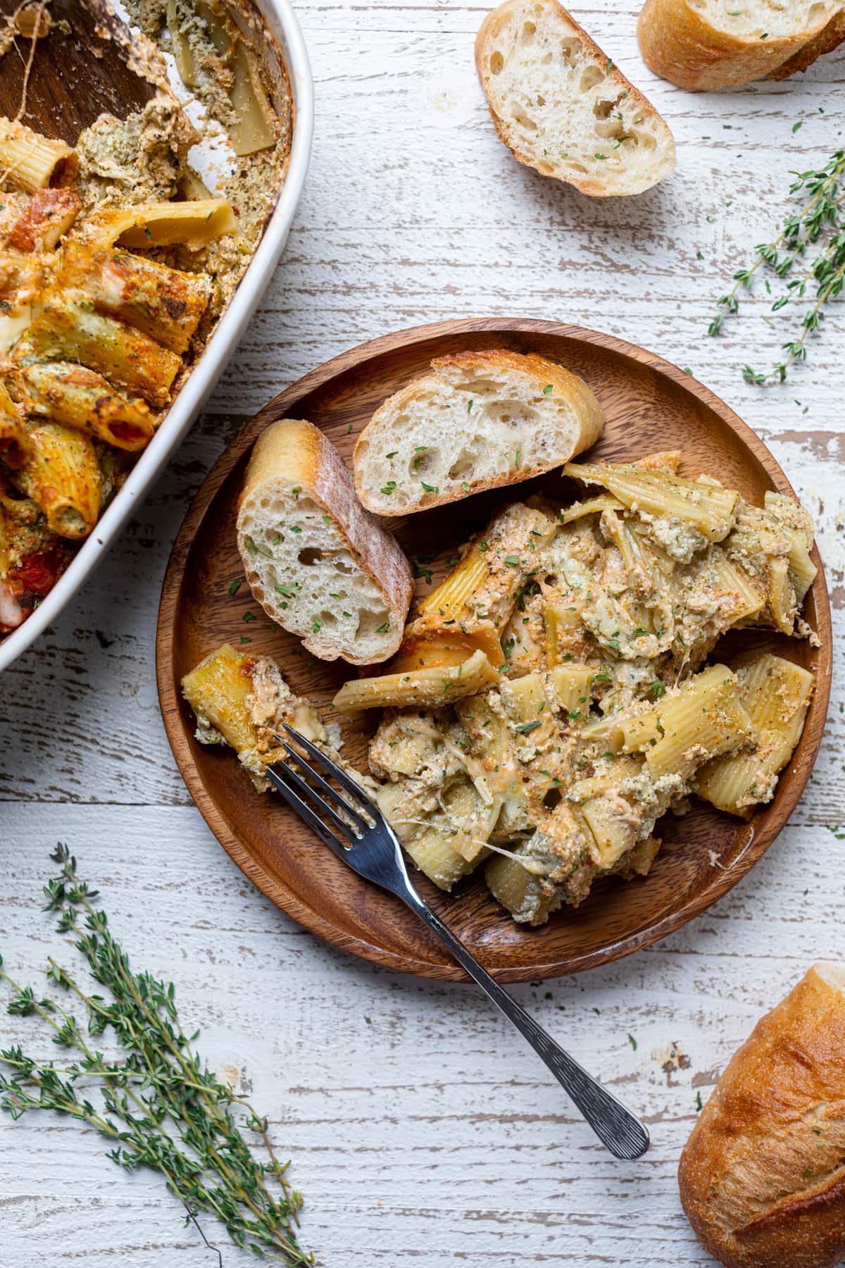 Wooden plate of bread and Pesto Pasta with Ricotta