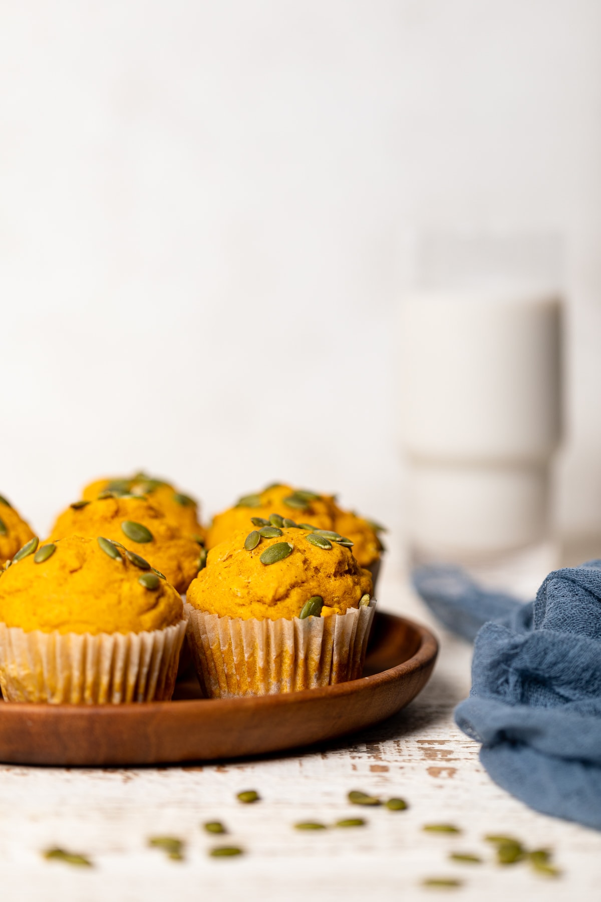 Vegan Pumpkin Spice Muffins on a wooden plate