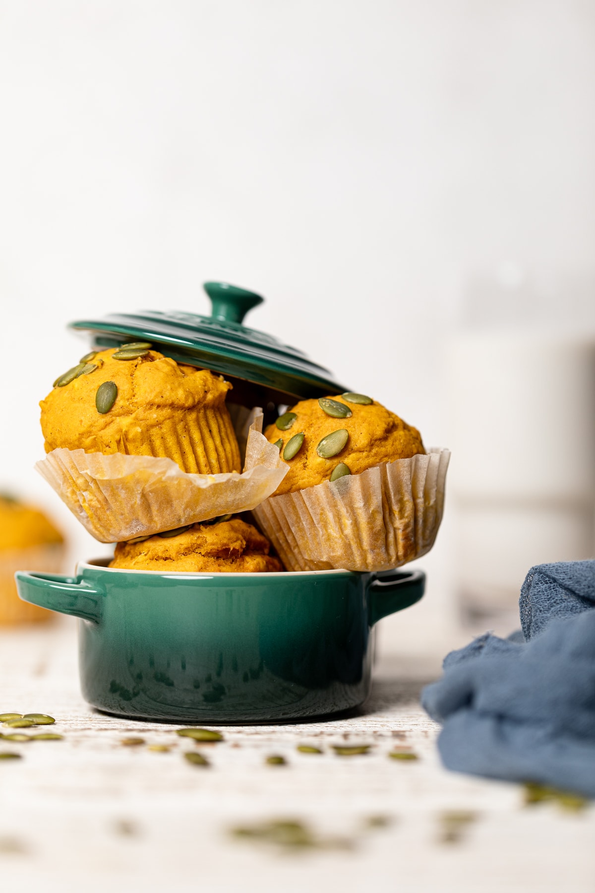 Vegan Pumpkin Spice Muffins stuffed into a small blue bowl