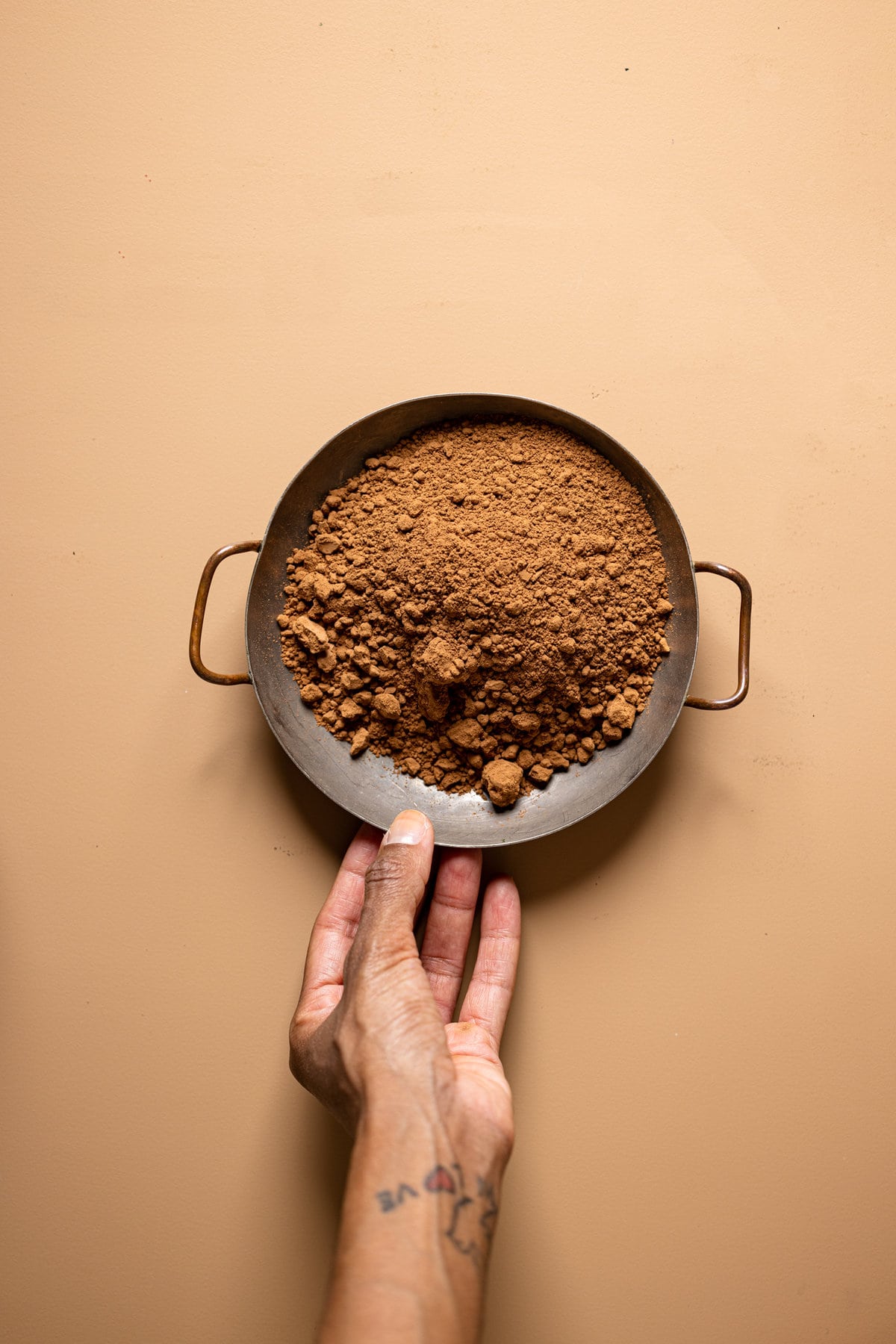 Metal bowl of cocoa powder