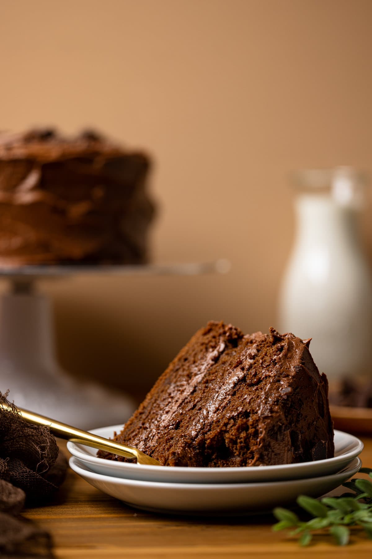 Slice of Vegan Chocolate Cake on its side and missing a bite