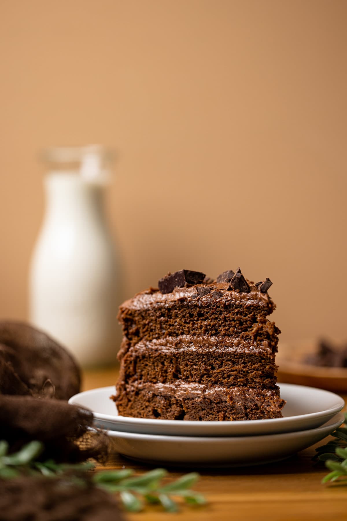 Slice of Vegan Chocolate Cake on two white plates