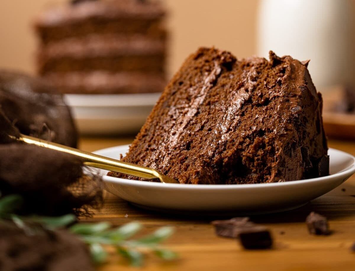 Slice of Vegan Chocolate Cake missing a bite