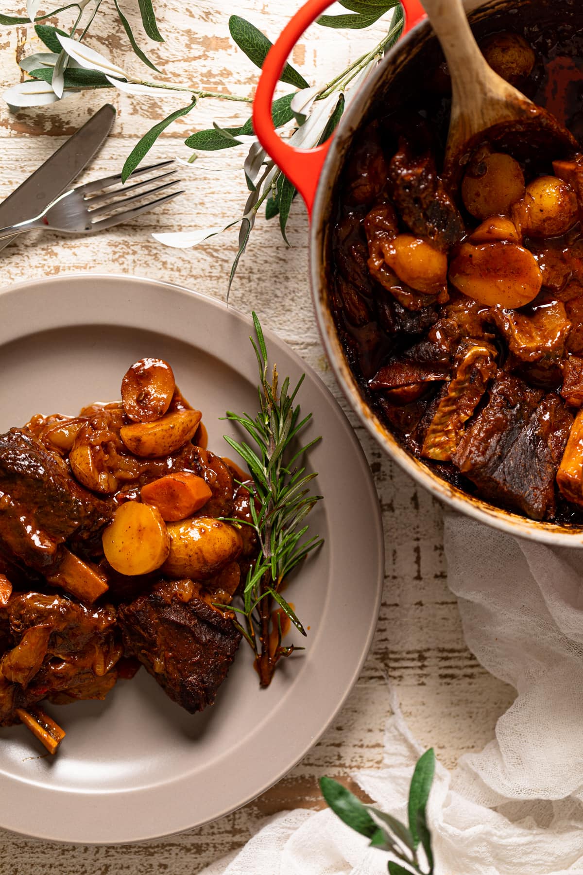 Plate and Dutch oven of Braised Apple barbeque Ribs and Potatoes