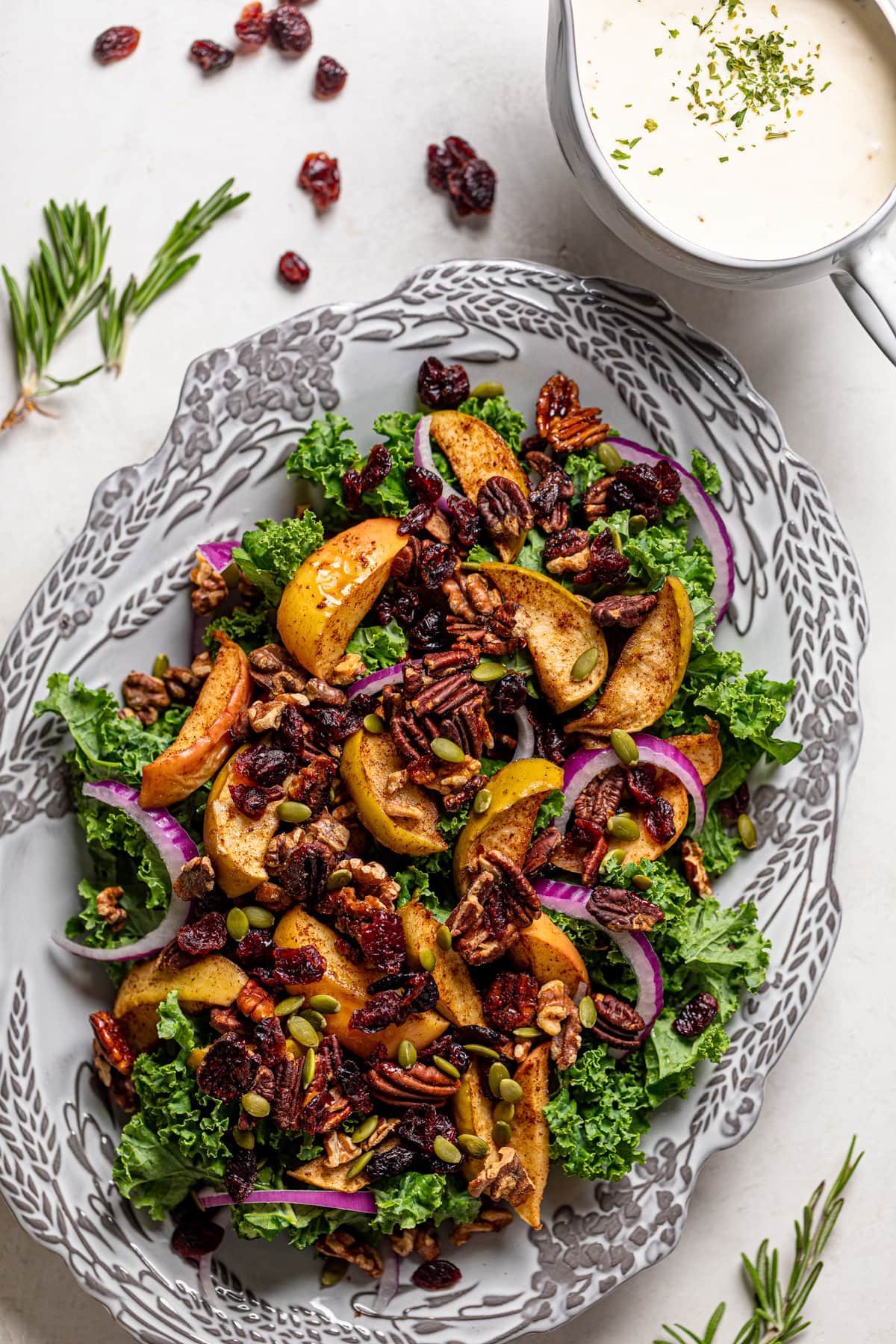 Colorful Apple Kale Salad on a decorated serving platter