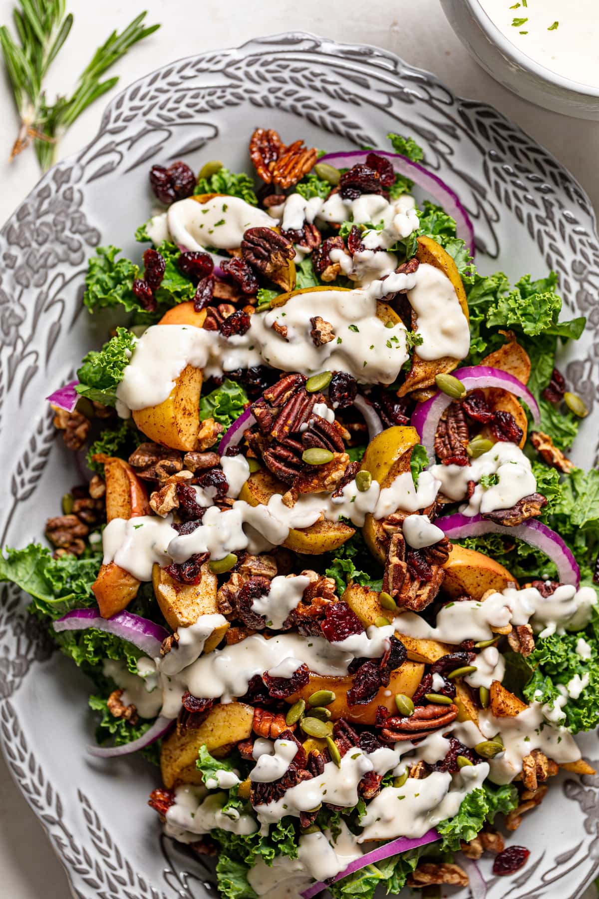 Fall Harvest Apple Kale Salad drizzled with dairy-free lemon-garlic dressing