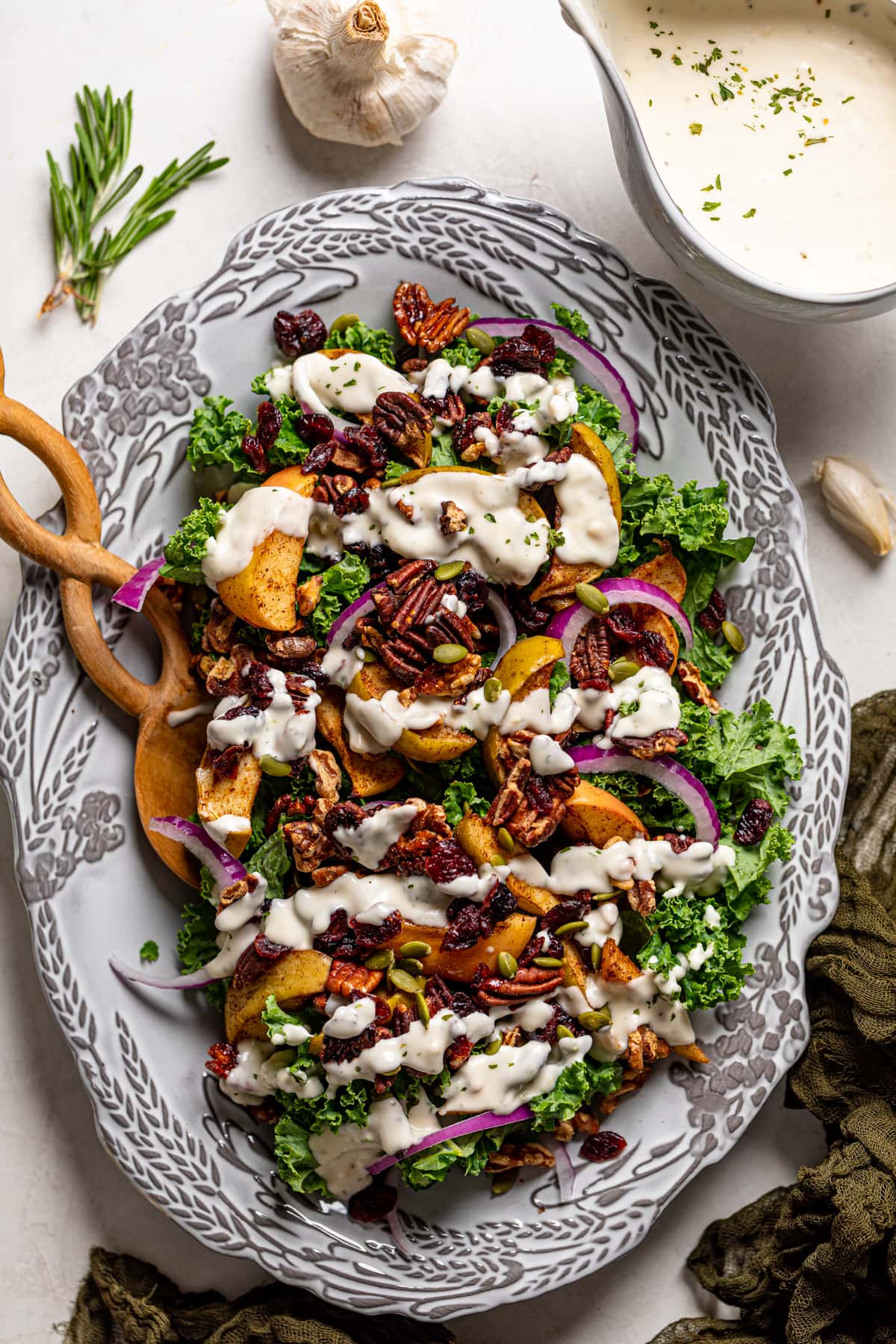 Fall Harvest Apple Kale Salad drizzled with dairy-free lemon-garlic dressing