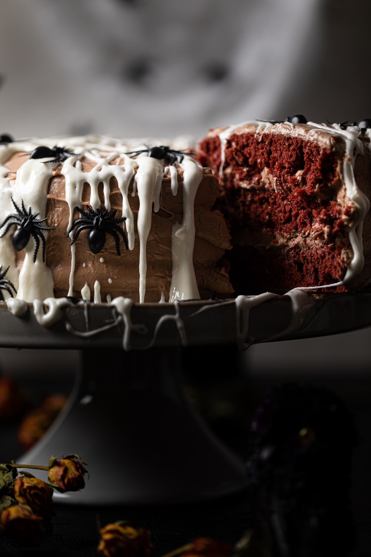 Black Widow Red Velvet Cake with a slice pulled out