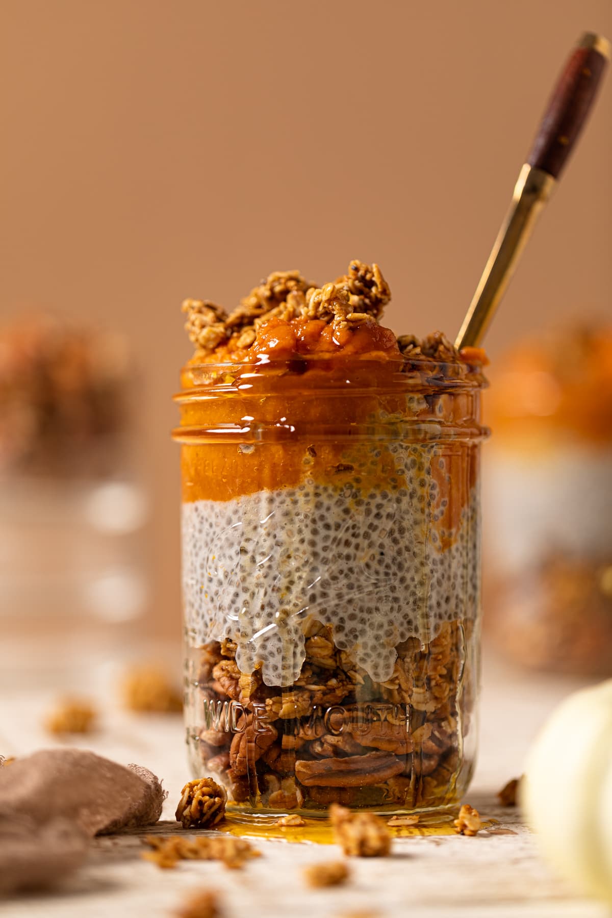 Spoon in a jar of Pumpkin Pie Chia Pudding