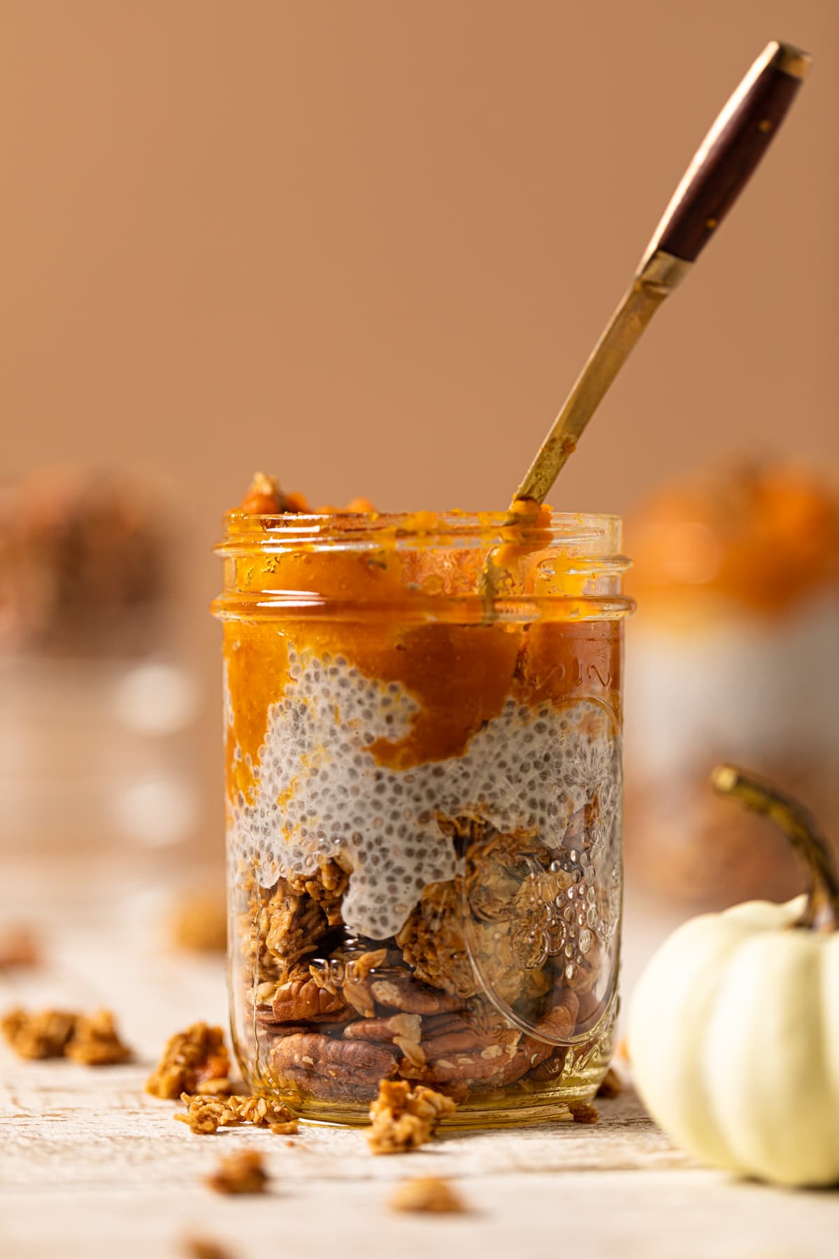 Spoon in a jar of Pumpkin Pie Chia Pudding