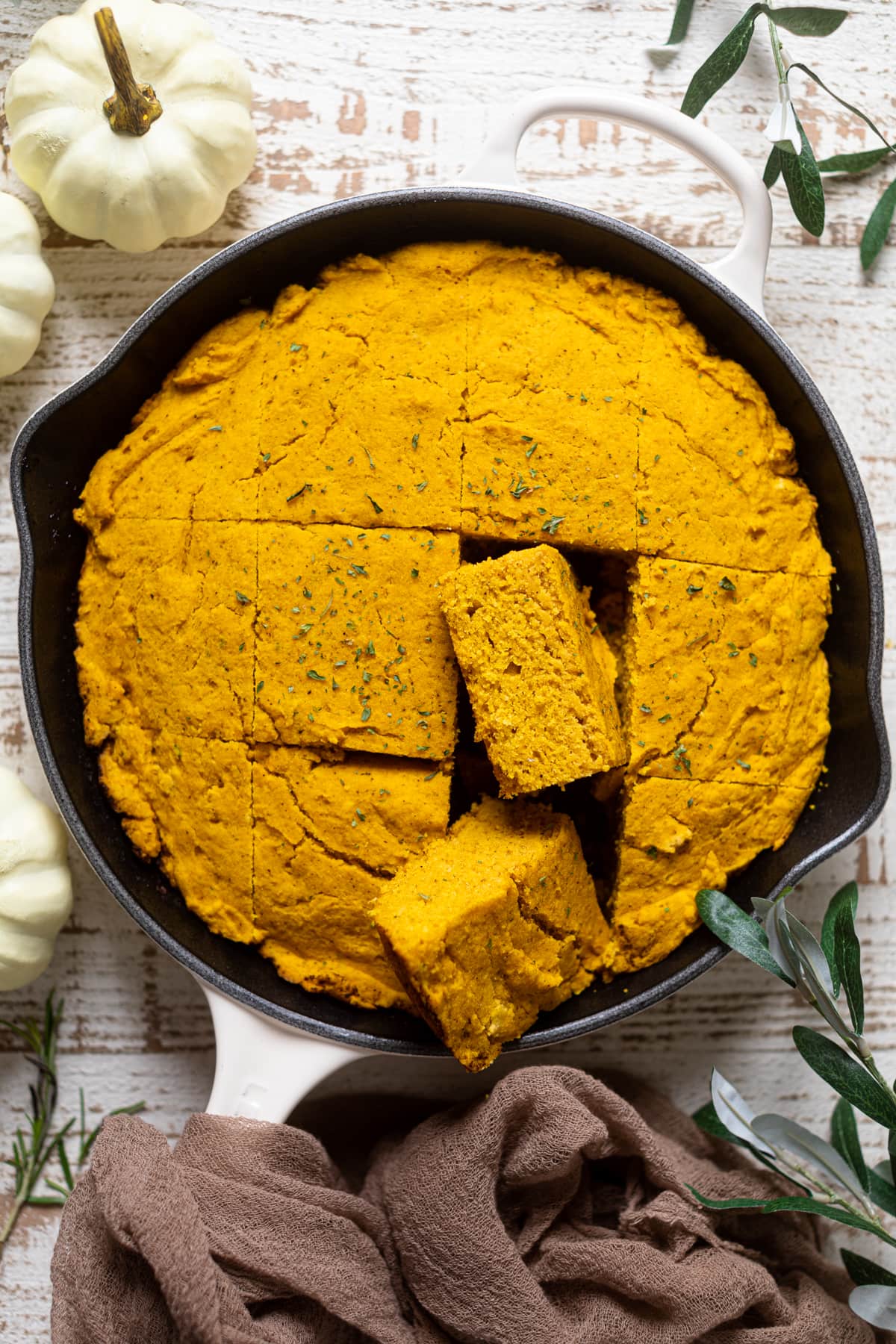 Sliced Brown Butter Pumpkin Cornbread in a skillet