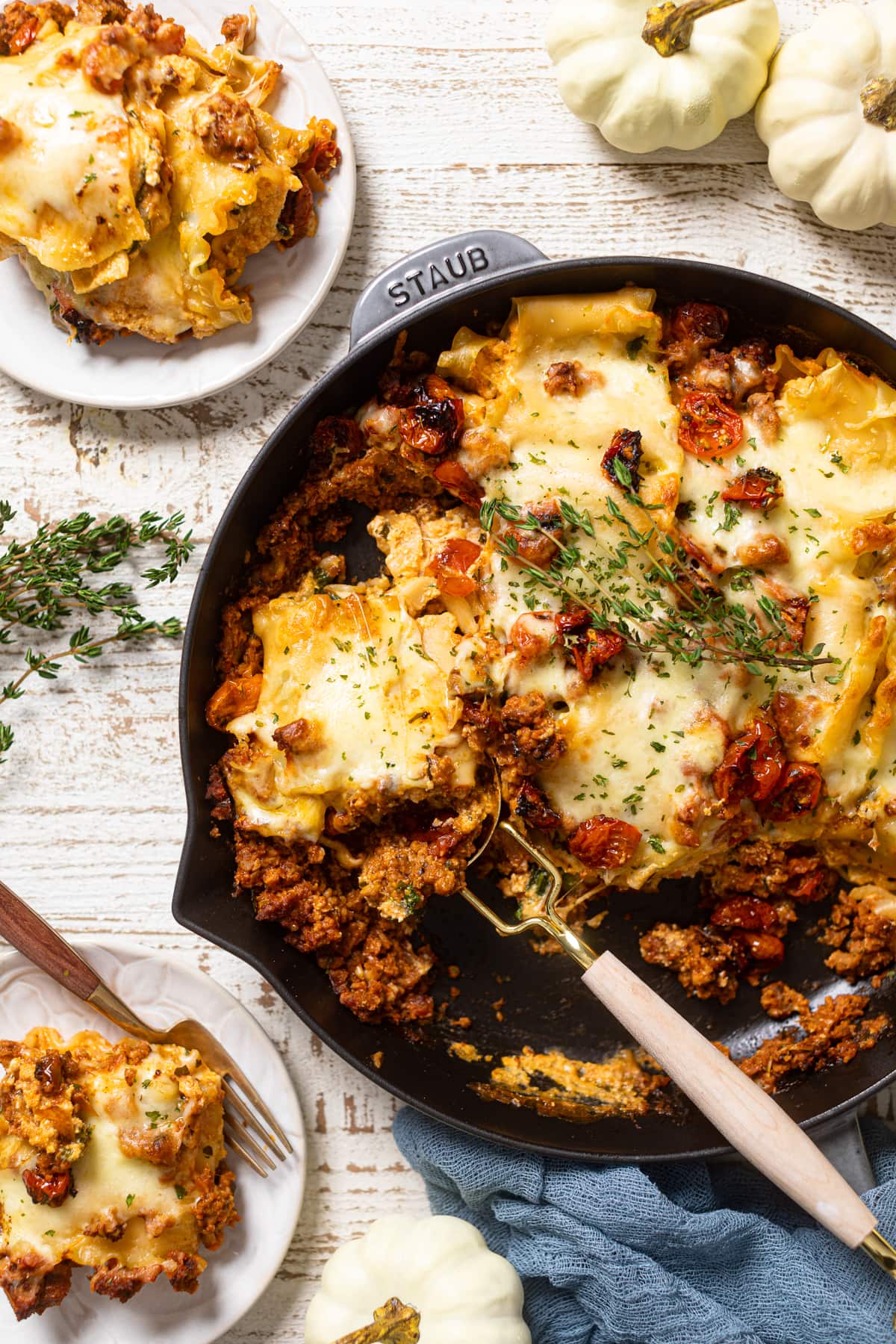 Spoon scooping from a skillet of Meatless Pumpkin Lasagna