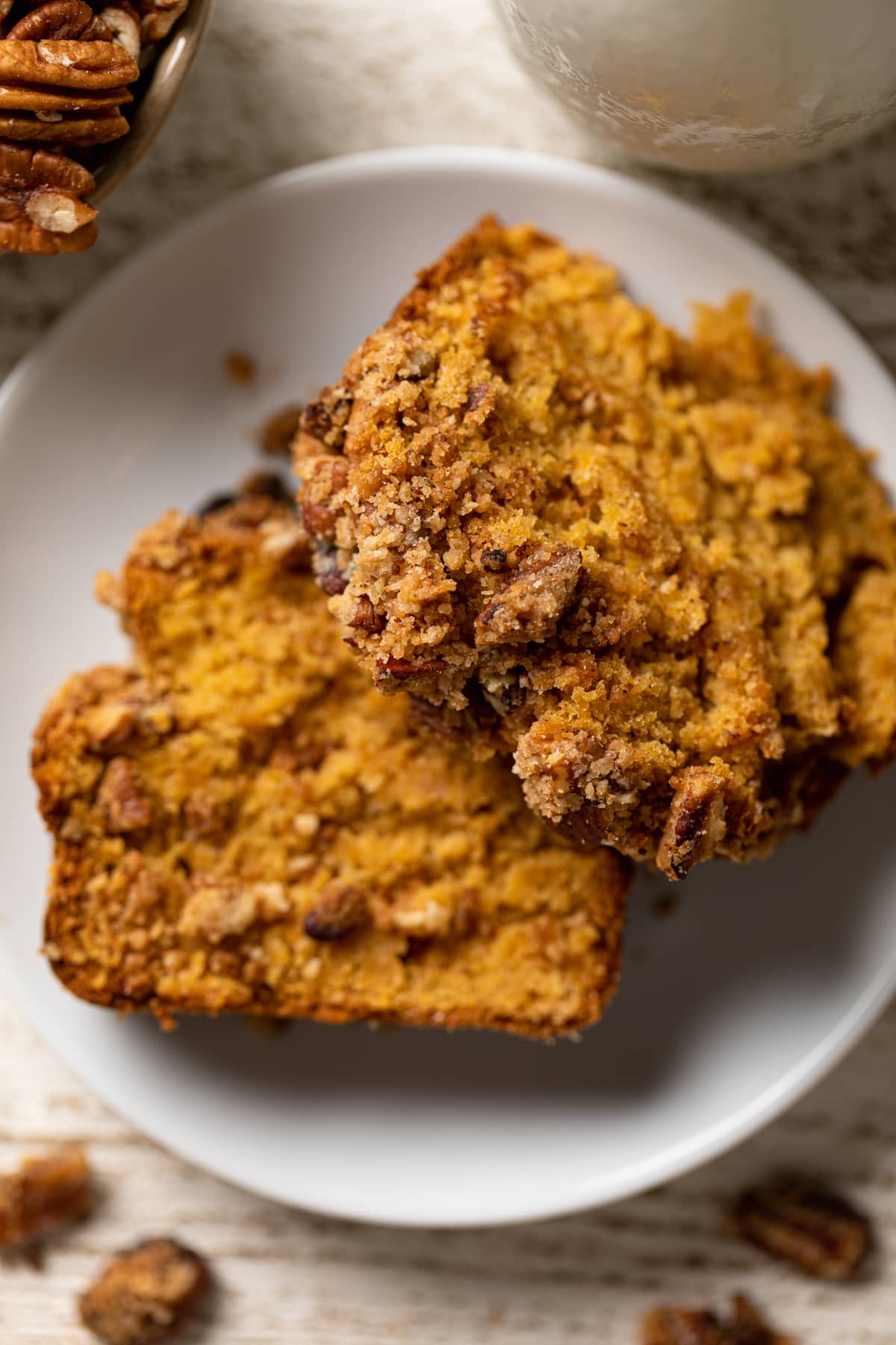 Slices of Vegan Sweet Potato Crumble Bread on a white plate