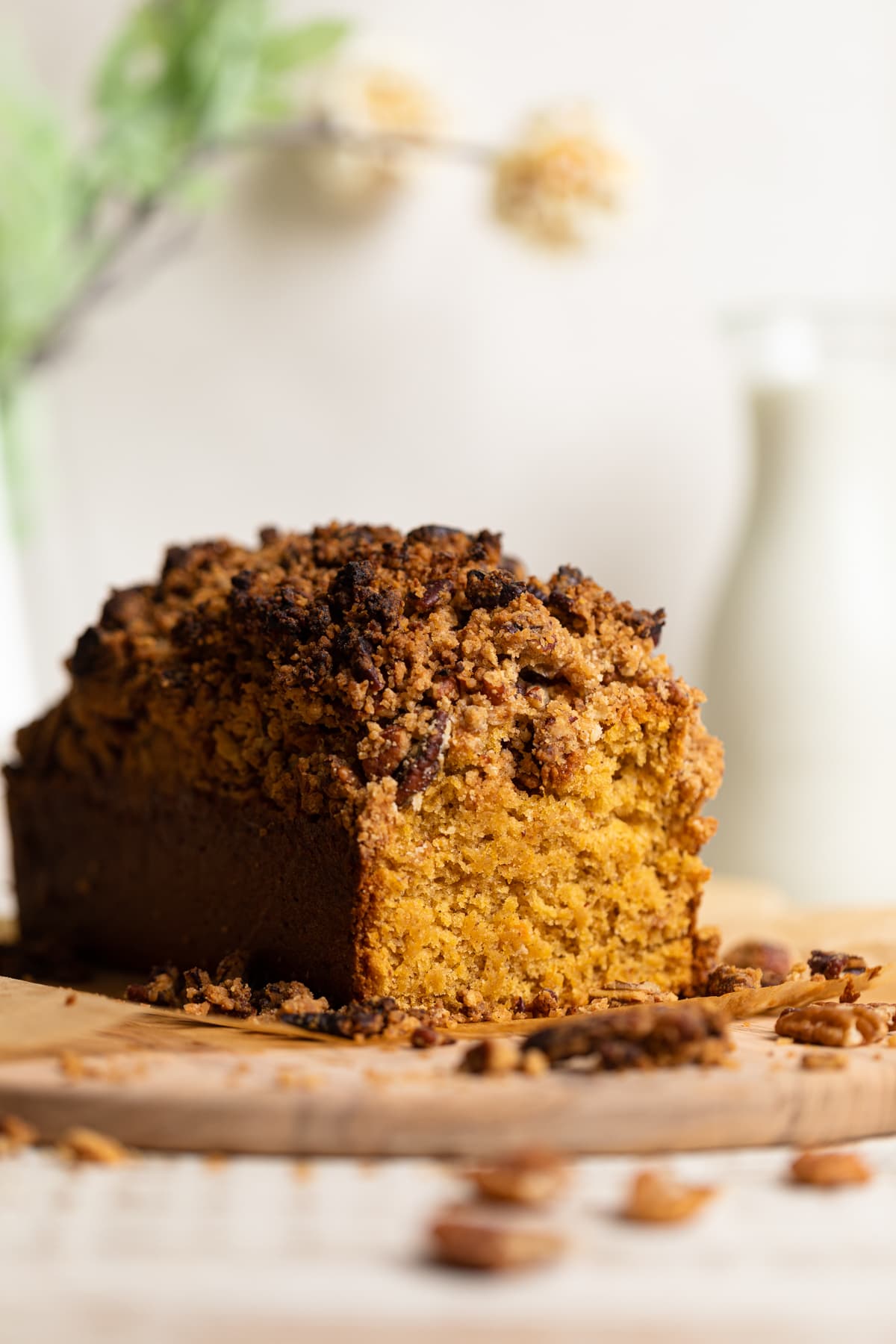 Loaf of Vegan Sweet Potato Crunch Bread with one end sliced off