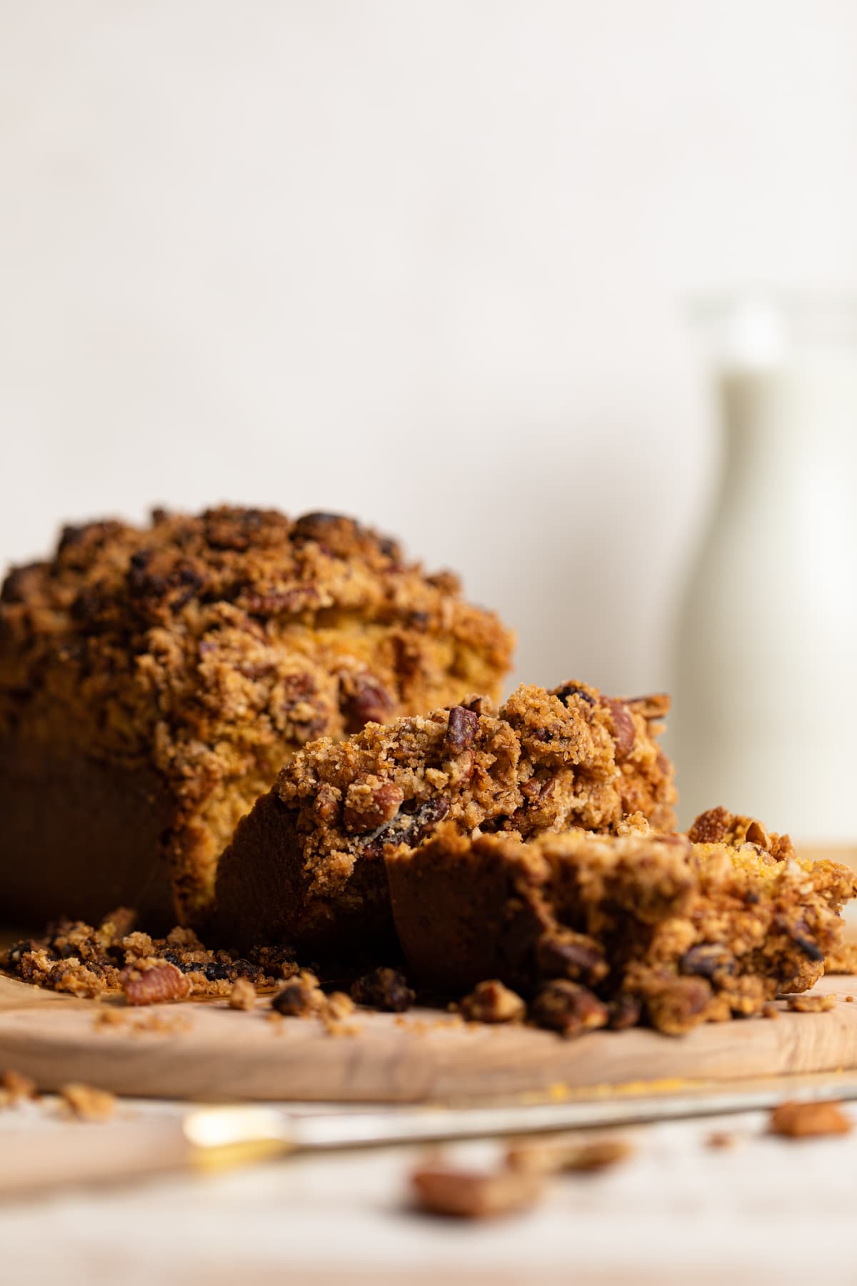 Sliced Vegan Sweet Potato Crumble Bread on a wooden board