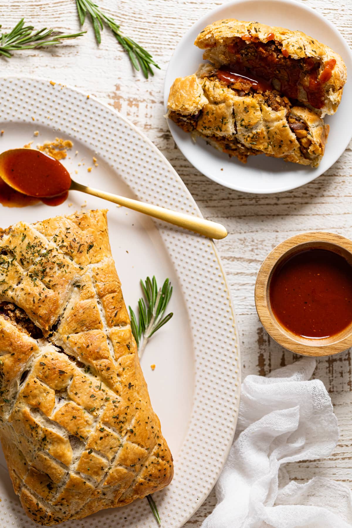 Vegan barbeque Wellington on a platter and a plate