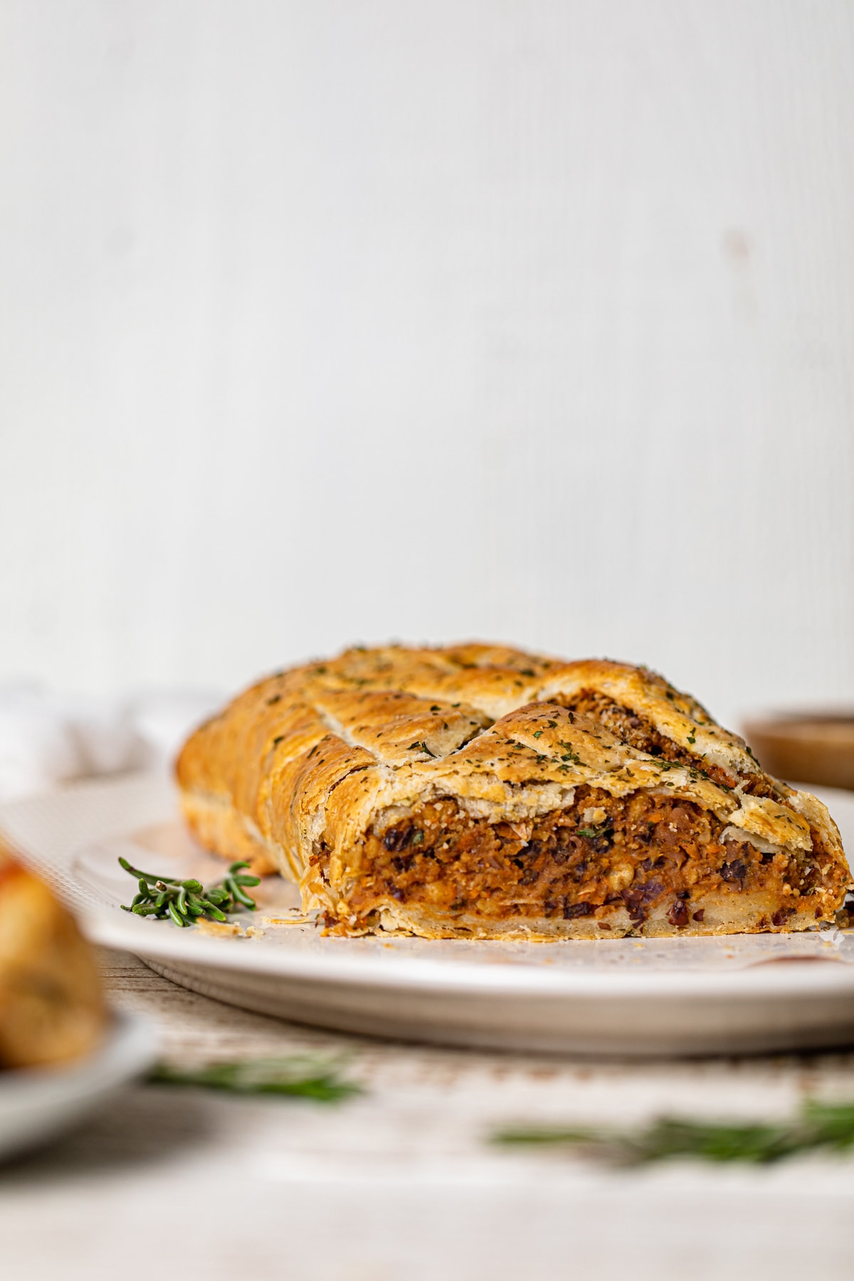 Vegan barbeque Wellington with one end sliced off