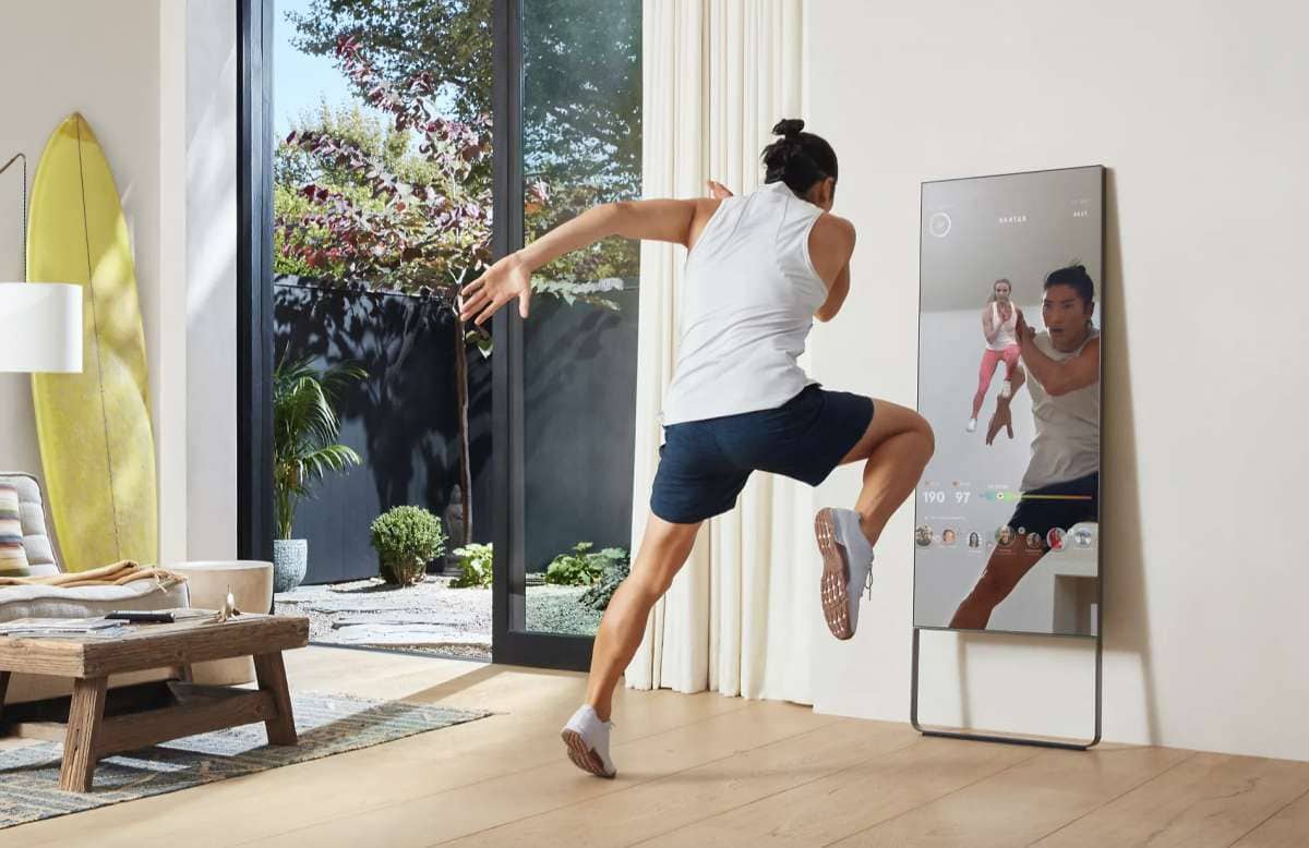 Person working out in front of The Mirror