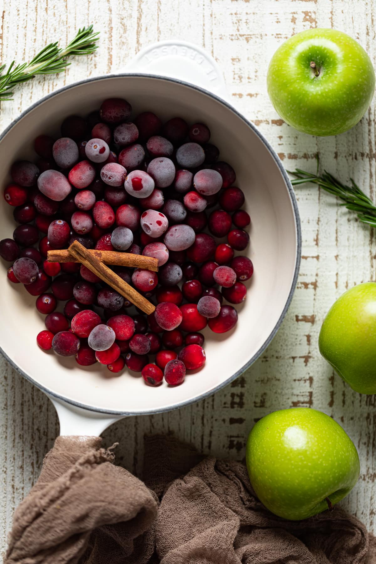 Ingredients-- frozen cranberries, cinnamon sticks, and green apples