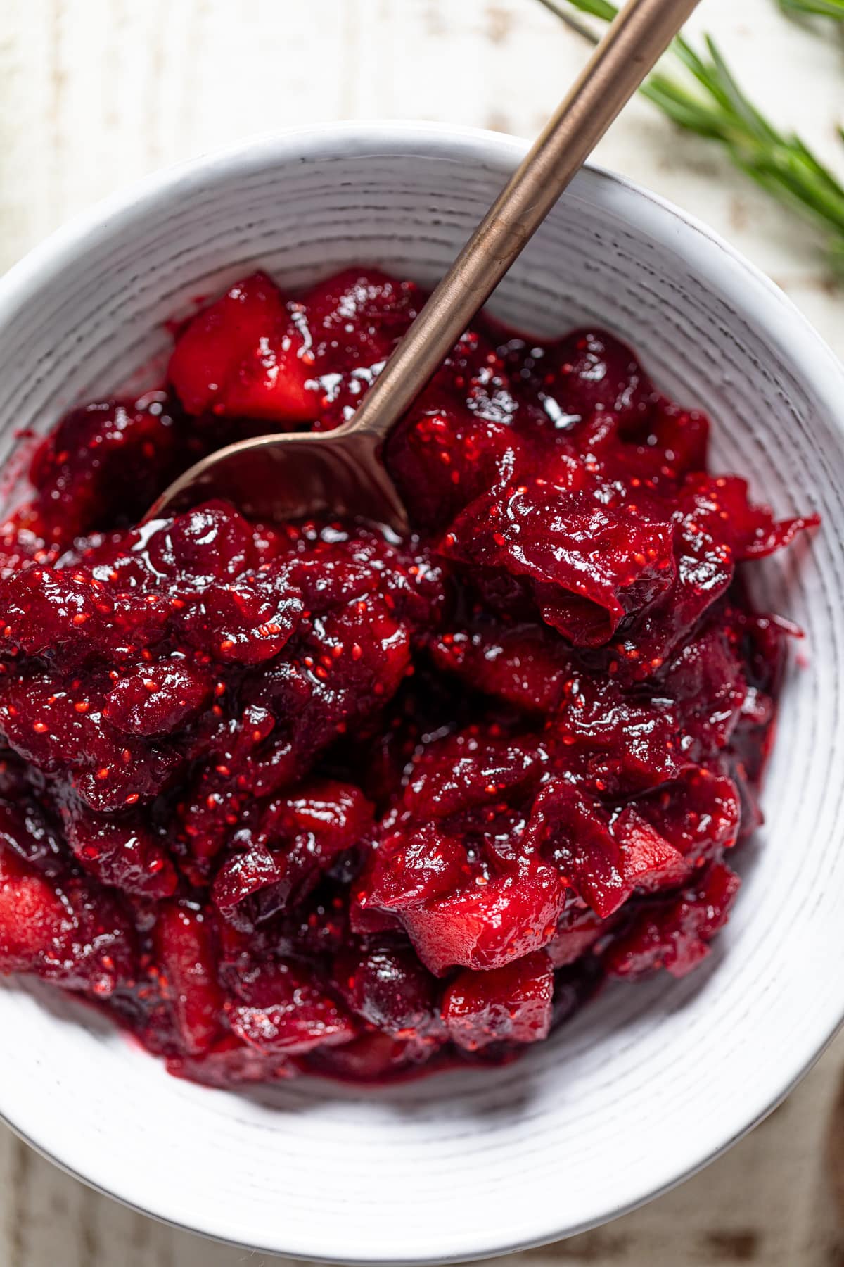 Spoon scooping some Apple Cranberry Sauce