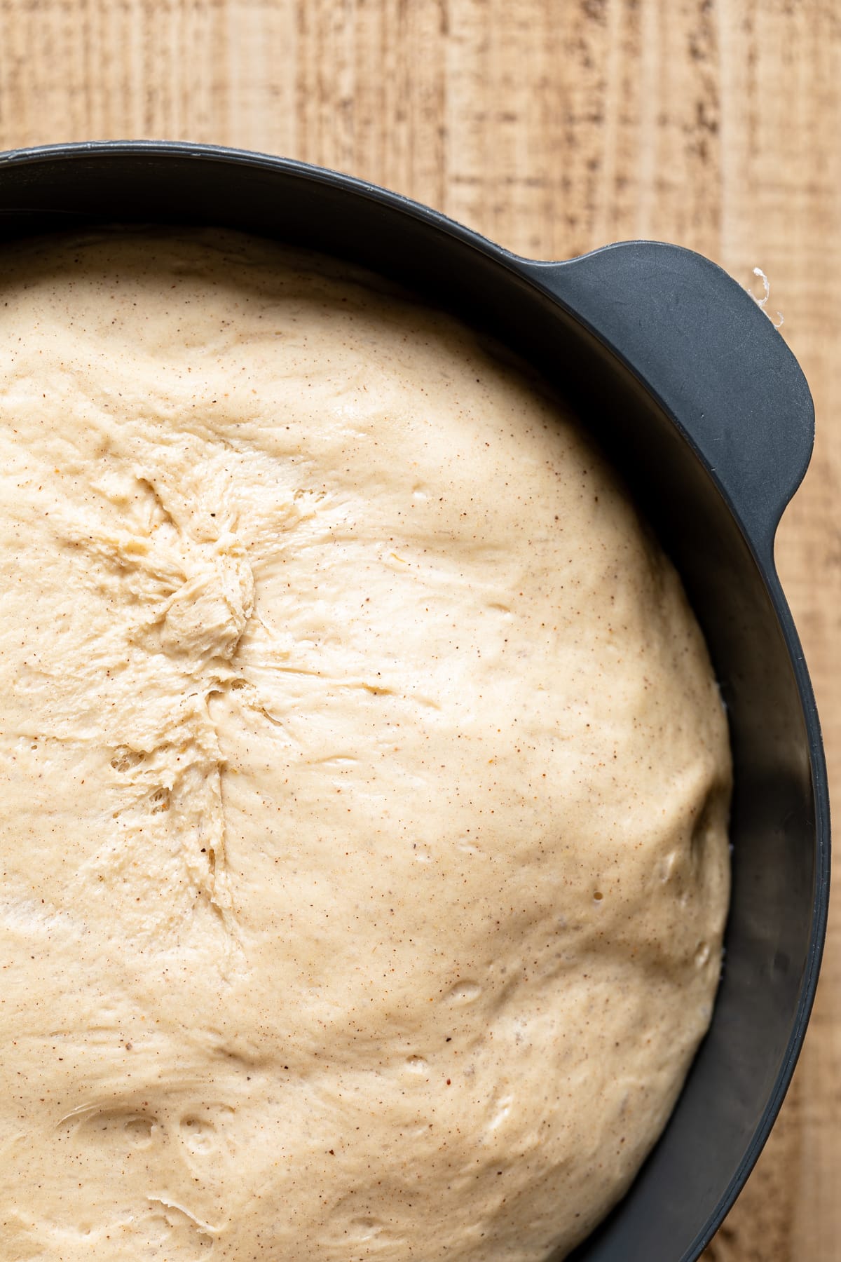 Risen Banana Bread Cinnamon Roll dough in a bowl