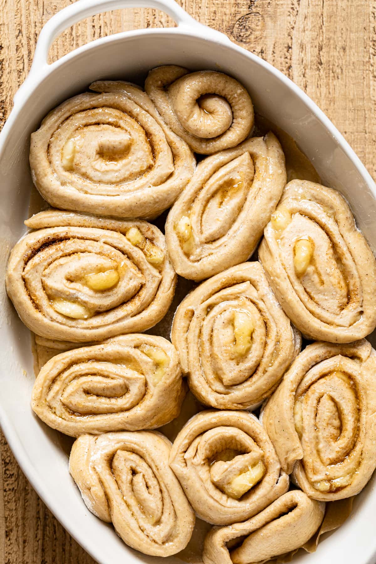 Raw Banana Bread Cinnamon Rolls in a baking pan