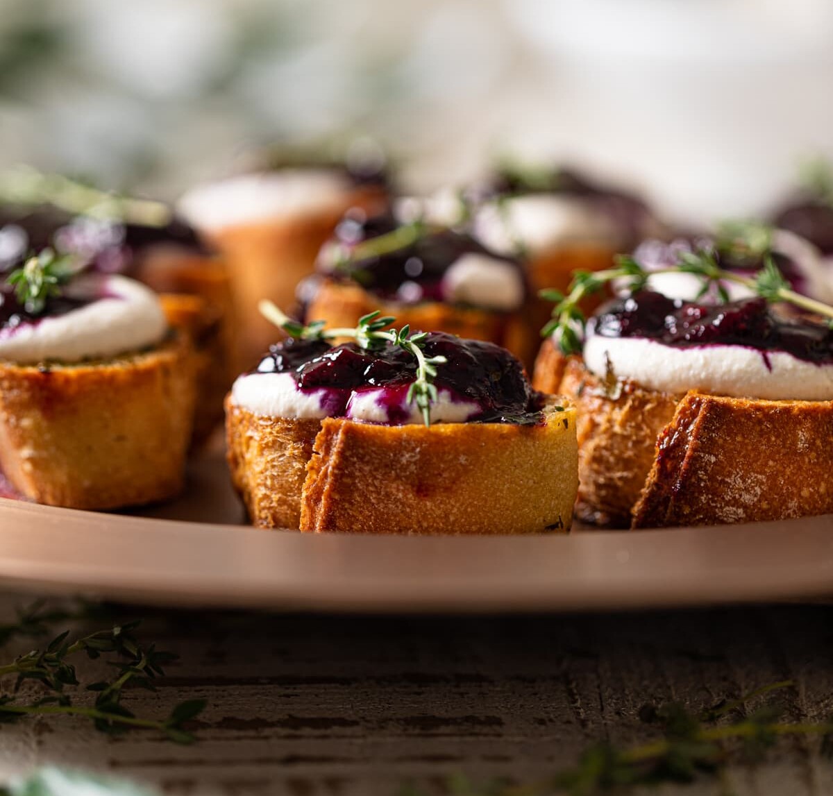 Vegan Blueberry Crostinis on a round dish