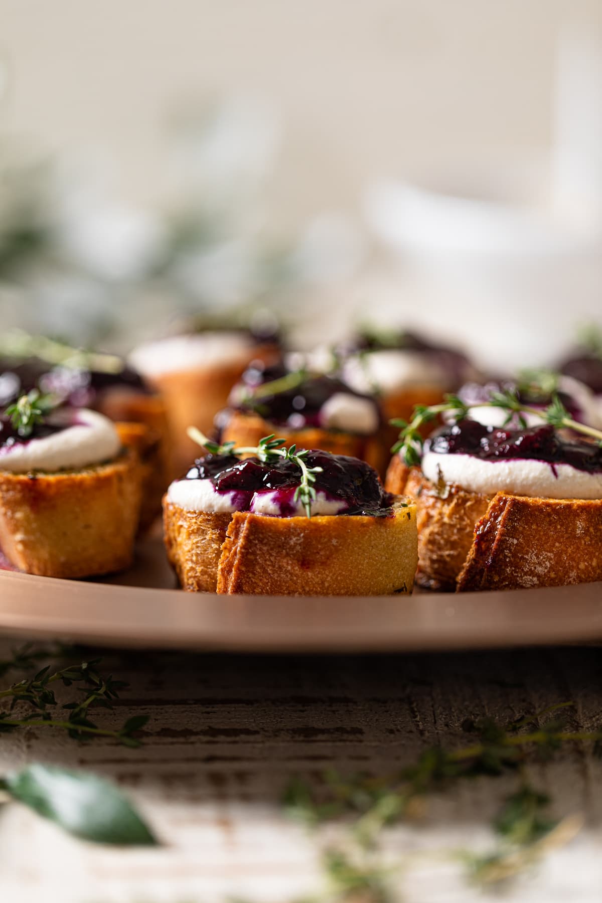 Vegan Blueberry Crostinis on a round dish