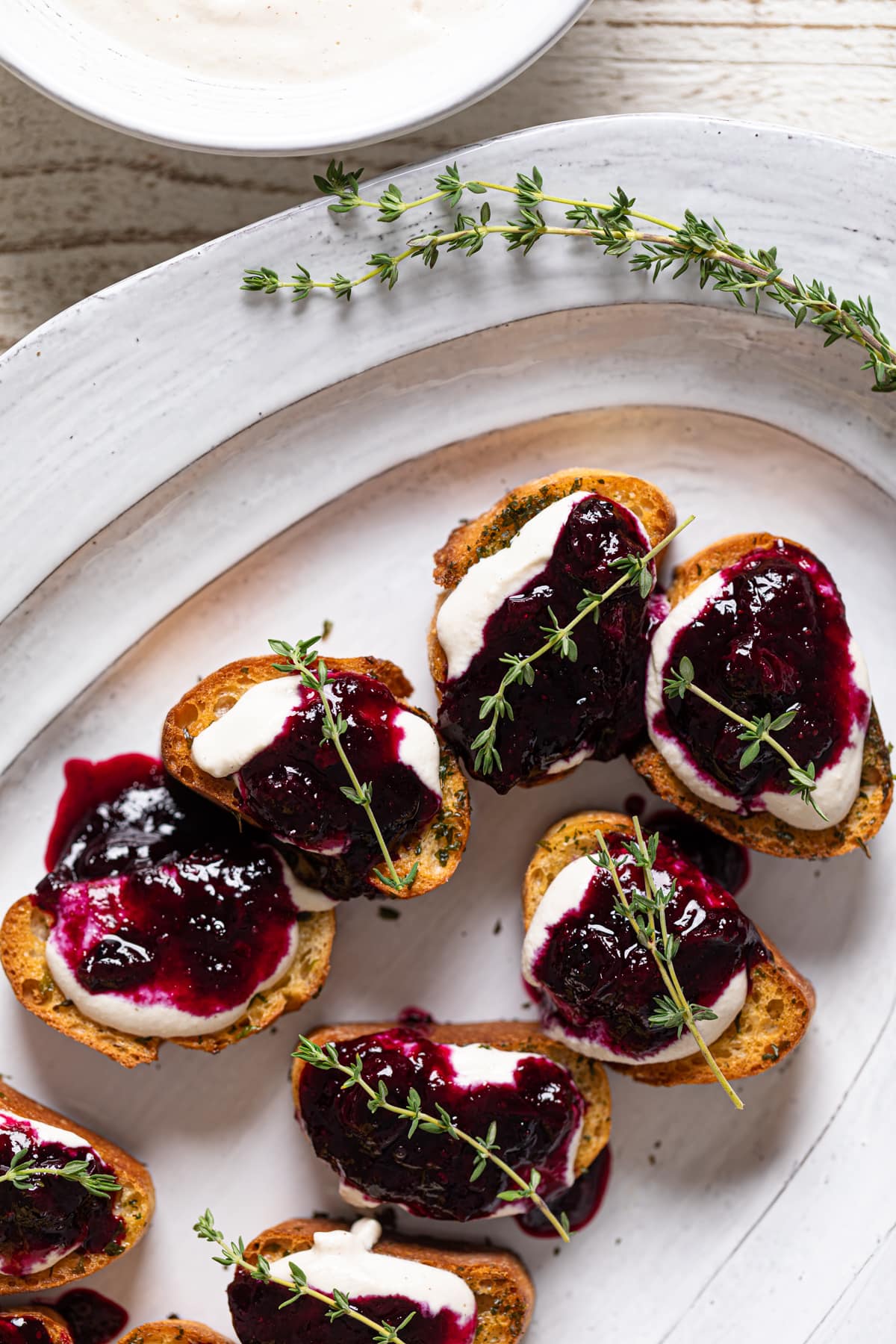 Overhead shot of a platter of Vegan Blueberry Crostinis