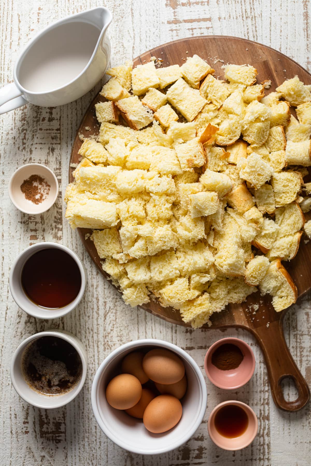 Ingredients for Cinnamon Brown Butter French Toast Casserole including eggs, cinnamon, and bread