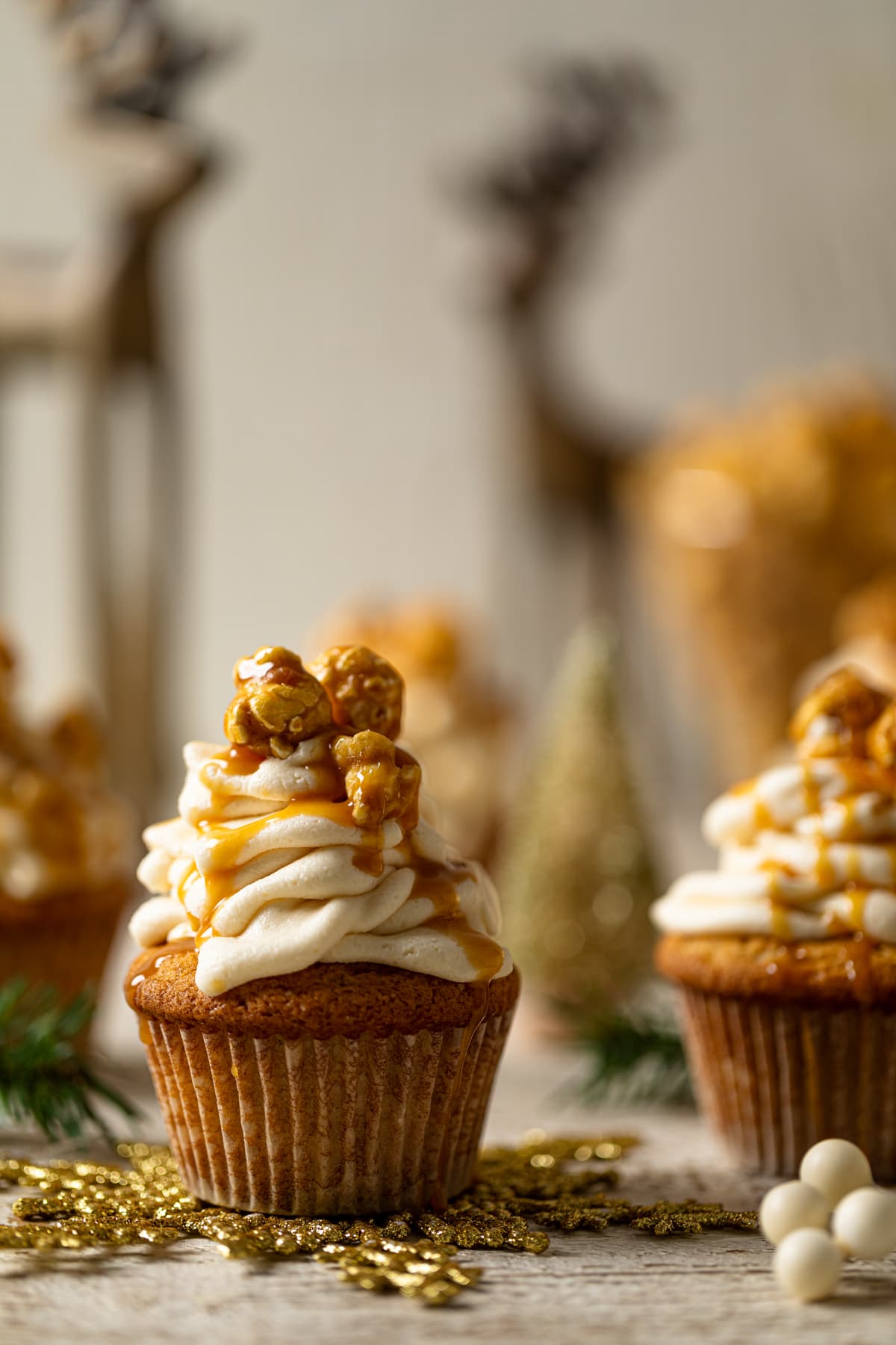 Caramel Eggnog Cupcake on a golden snowflake decoration