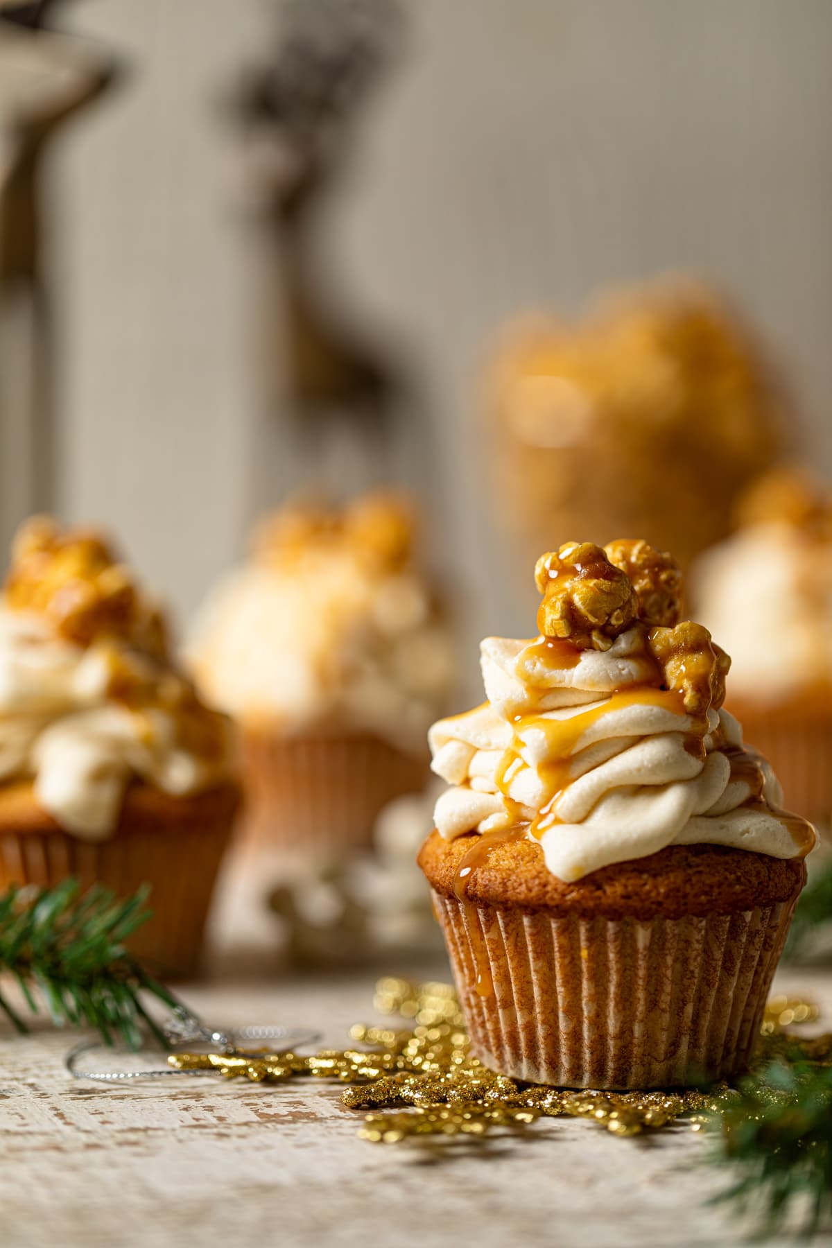 Caramel Eggnog Cupcake on a golden snowflake decoration